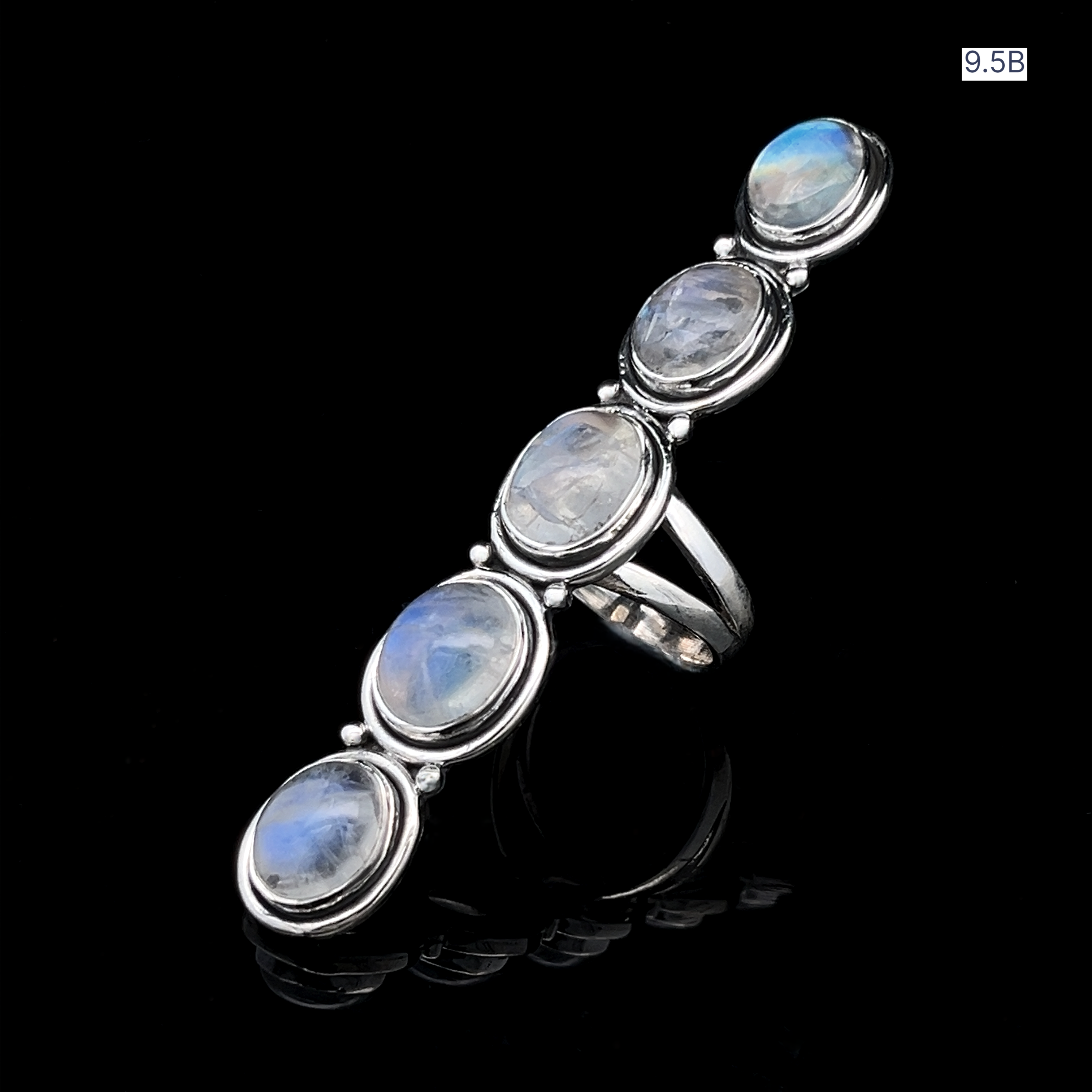 The Moonstone Ladder Ring, made of sterling silver with five oval moonstones in a row, is shown on a glossy black background. Size "9.5B" appears in the top right corner.