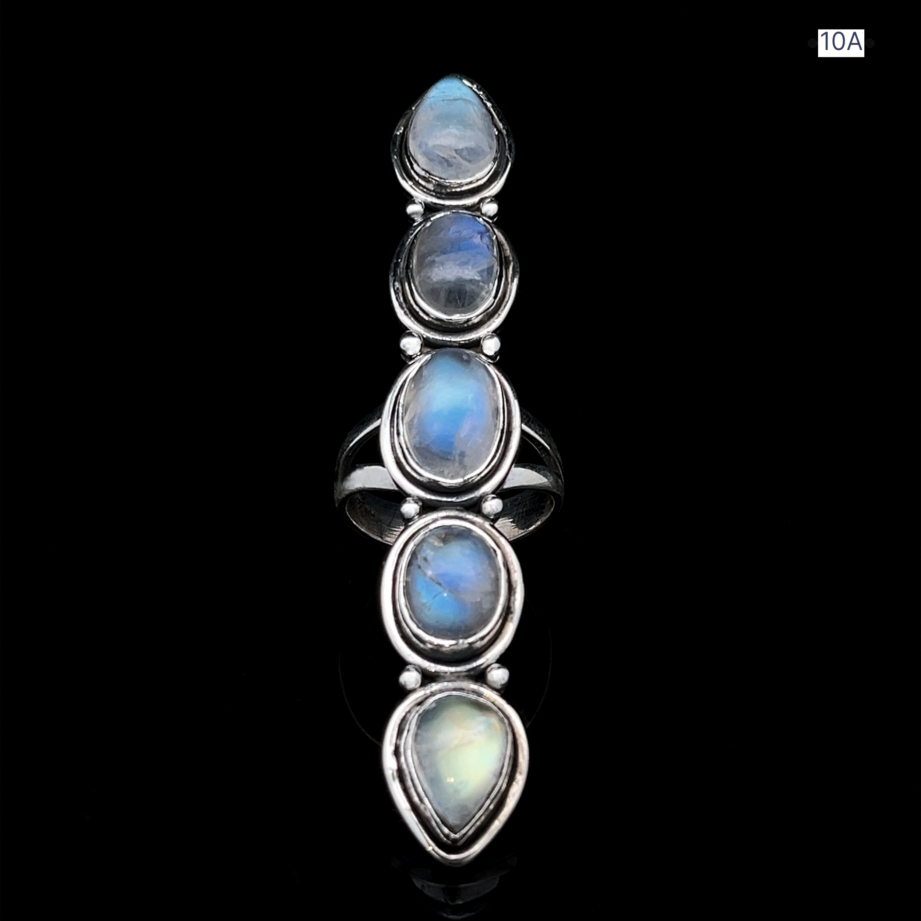 The Moonstone Ladder Ring, a sterling silver piece featuring five vertically aligned teardrop-shaped blue and white gemstones, is shown on a black background with "10A" labeled in the top right corner.