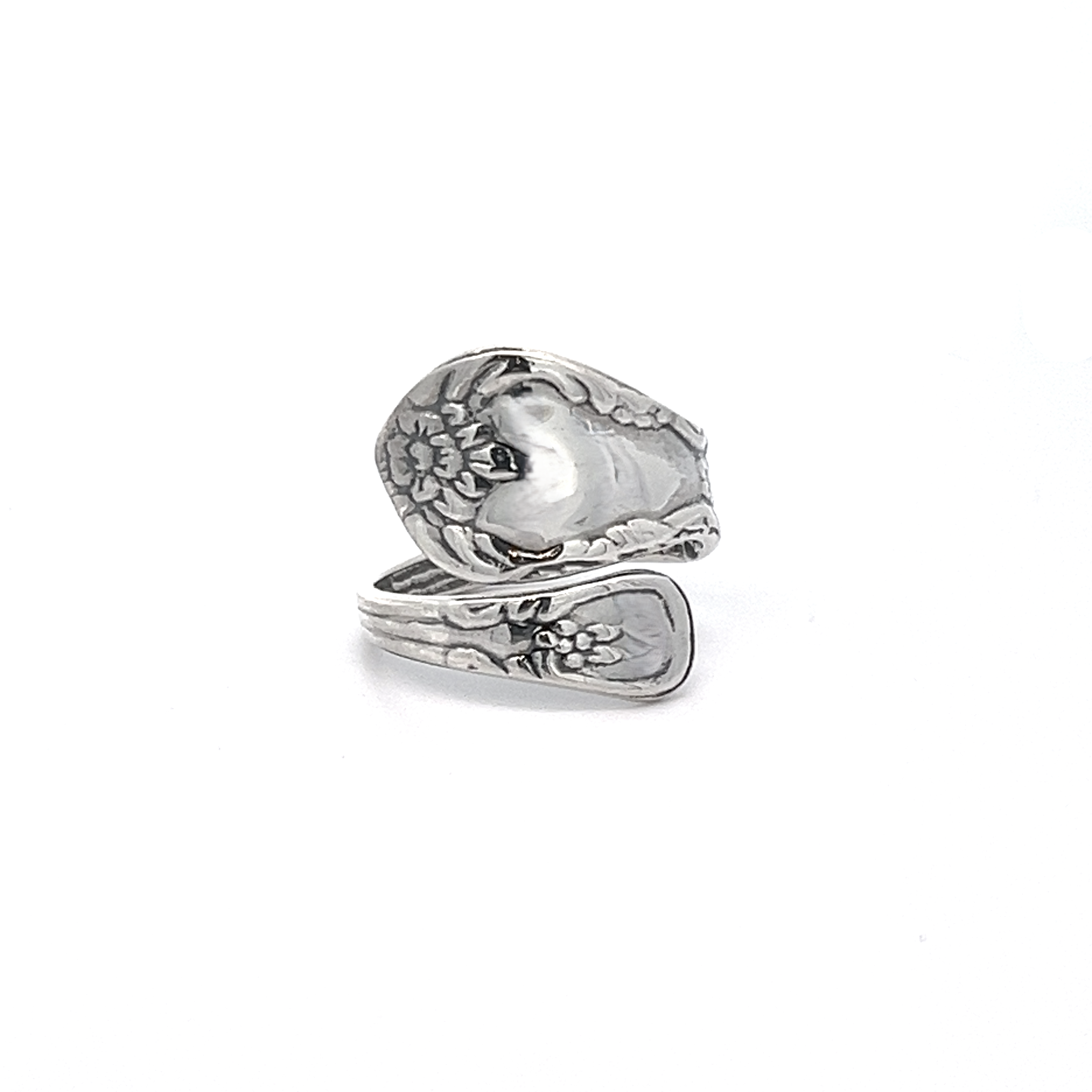 A timeless spoon ring featuring an ornate grapevine motif, crafted in a wrap-around style.