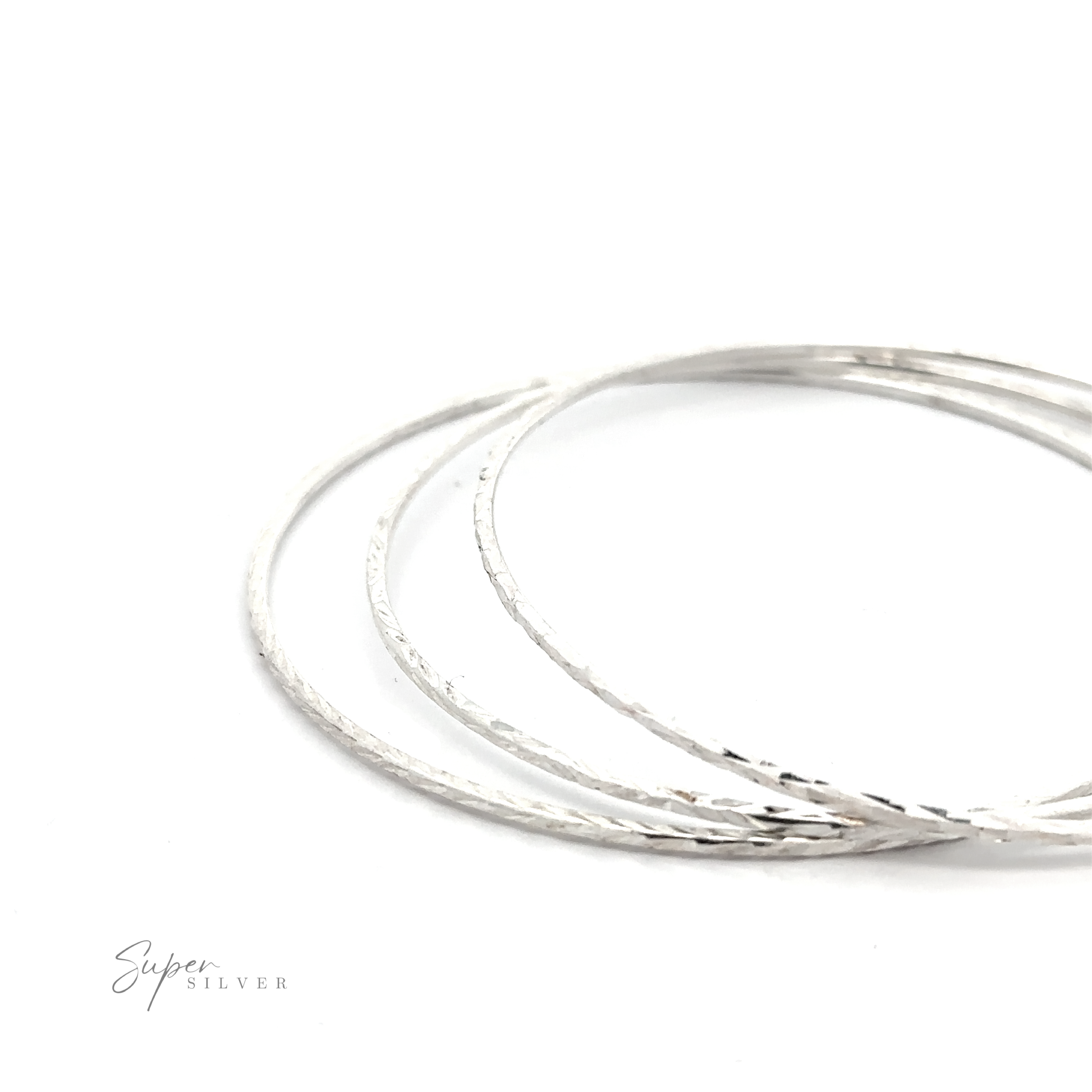 Three Dainty Squared Diamond Cut Bangles on a white background.