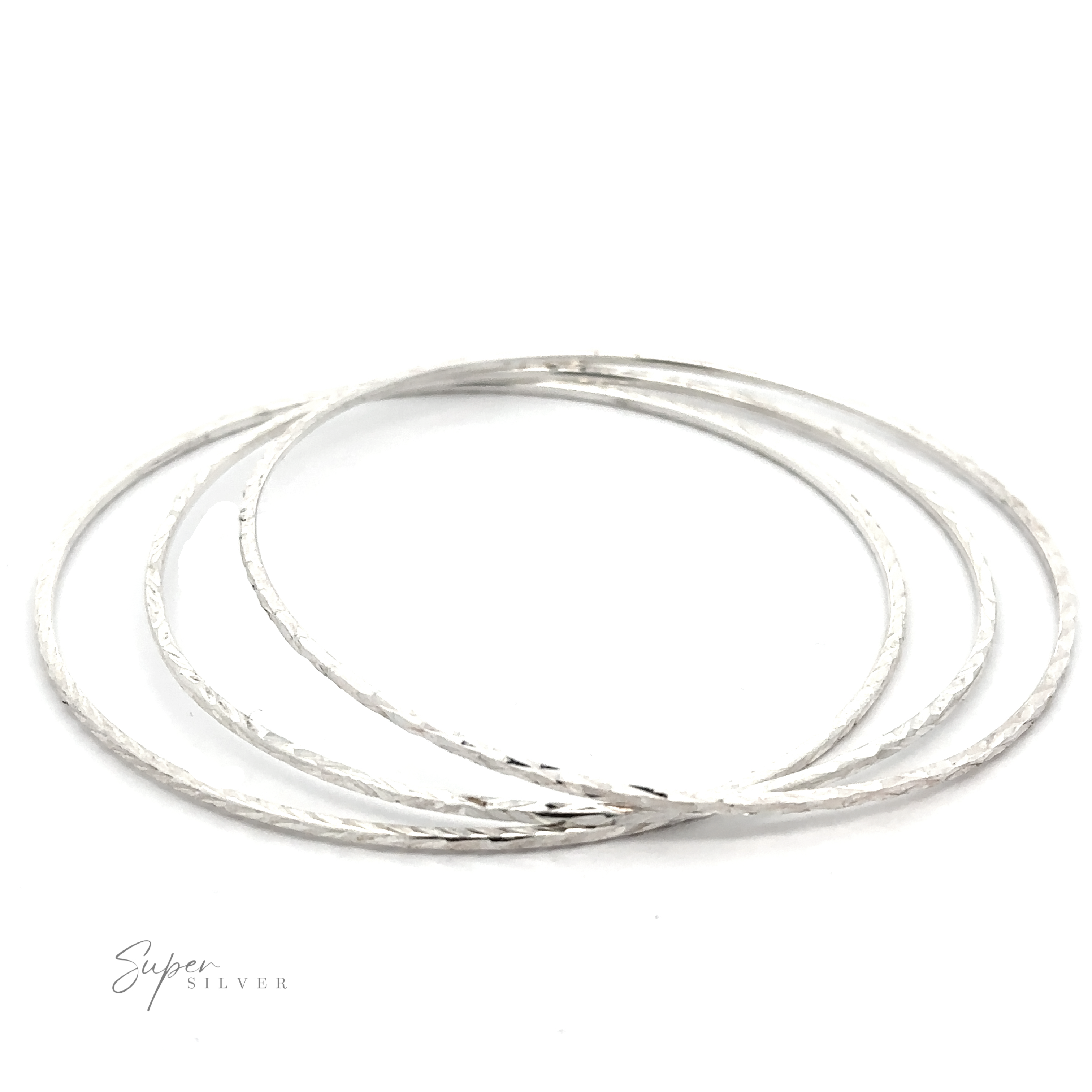 Three Dainty Squared Diamond Cut Bangles on a white background.