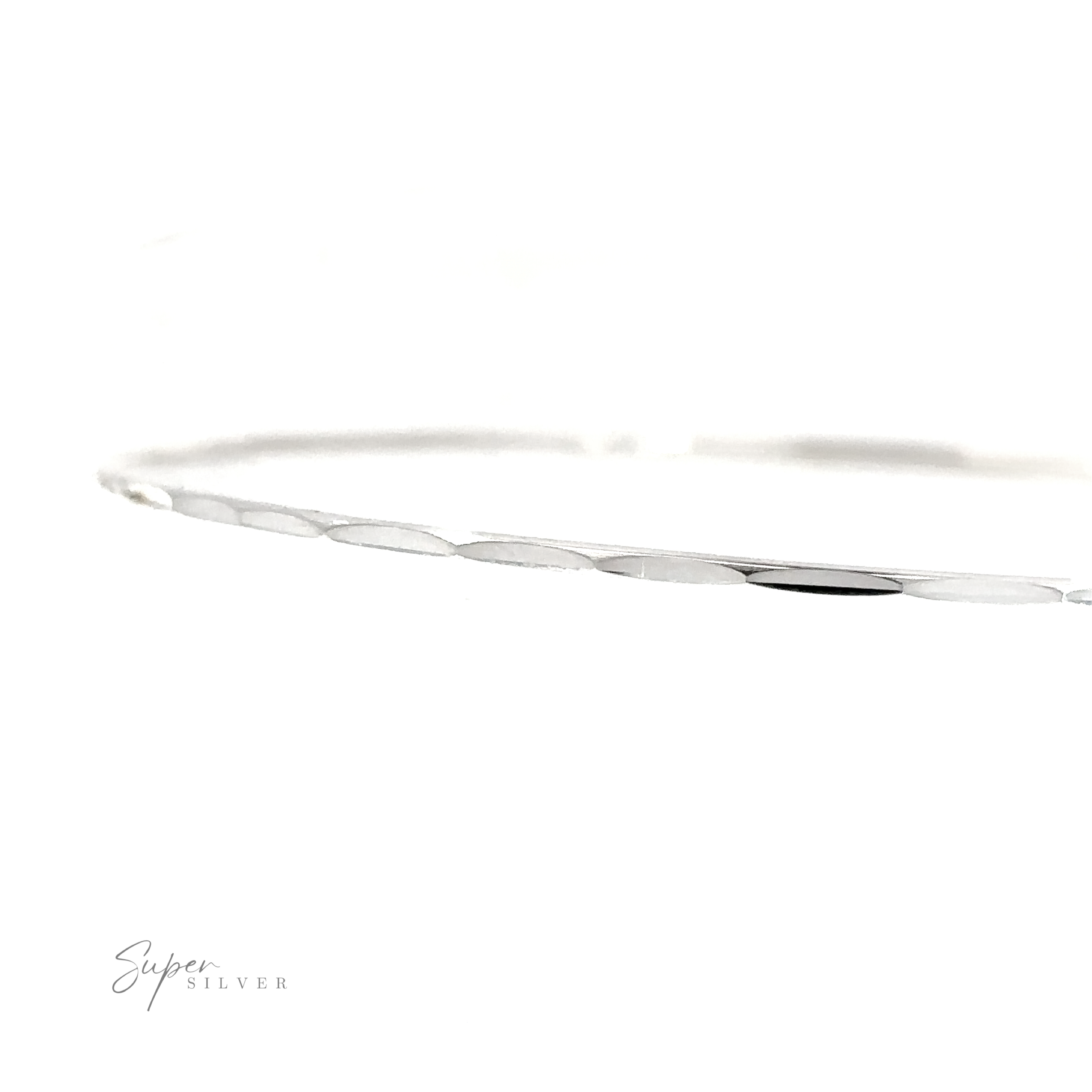 A Dainty Faceted Silver Bangle bracelet on a white background.