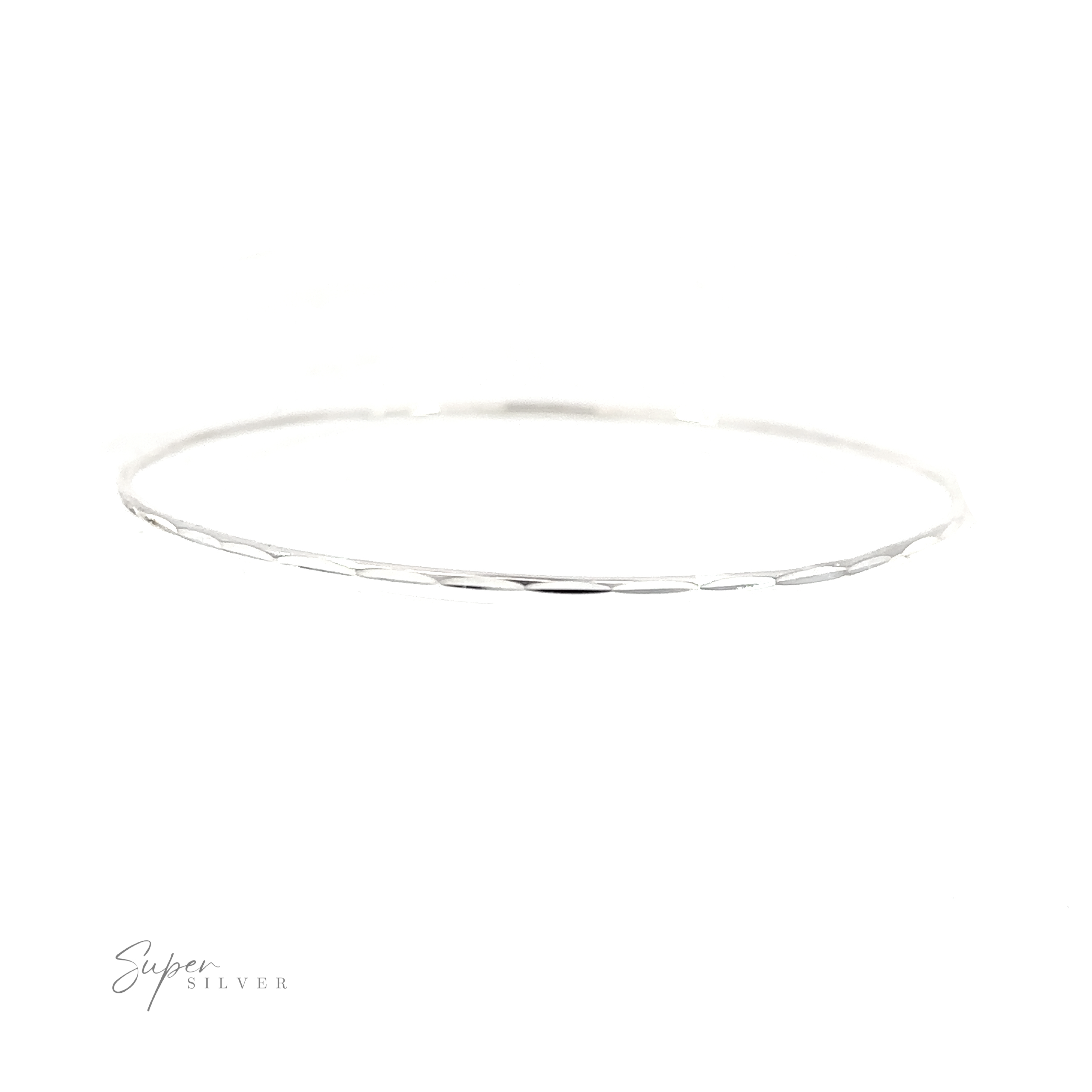 A Dainty Faceted Silver Bangle bracelet on a white background, made of .925 Sterling Silver.