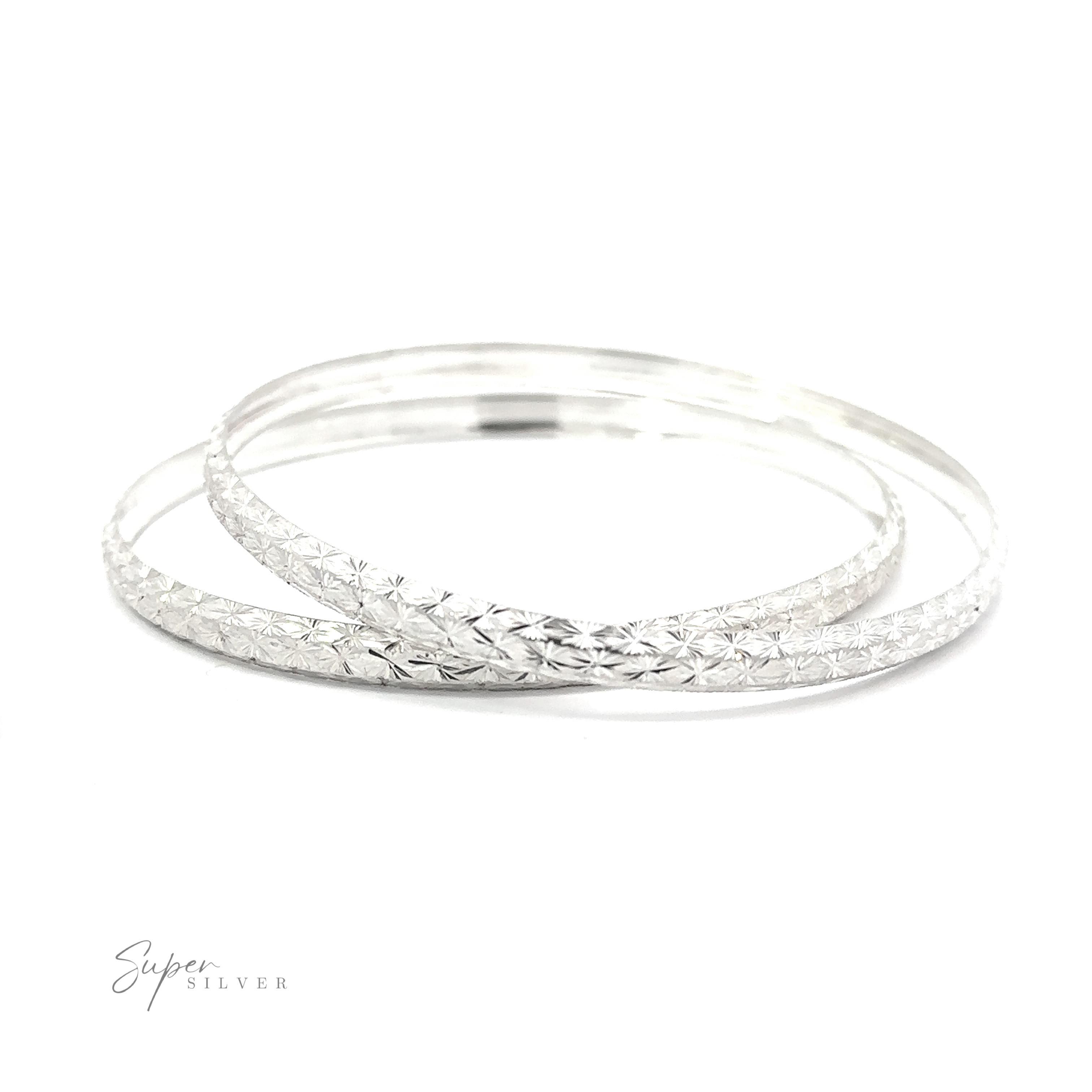 Two stunning Elegant Etched Bangle Bracelets on a white background.