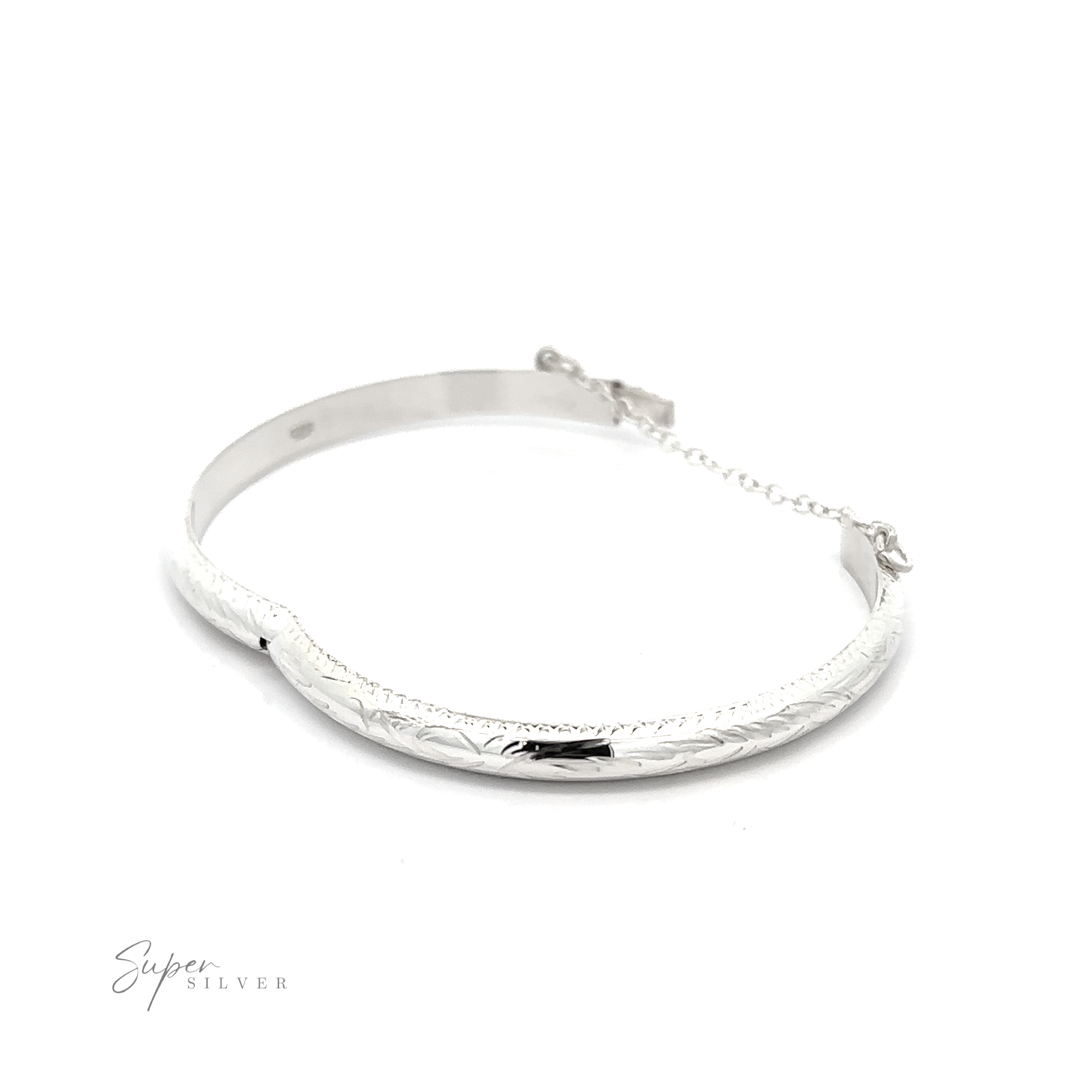 A Small Etched Latching Bangle with a smooth, slightly curved design and an engraved floral pattern. The Small Etched Latching Bangle is fastened with a small chain for secure closure. Text on the image reads "Super Silver.