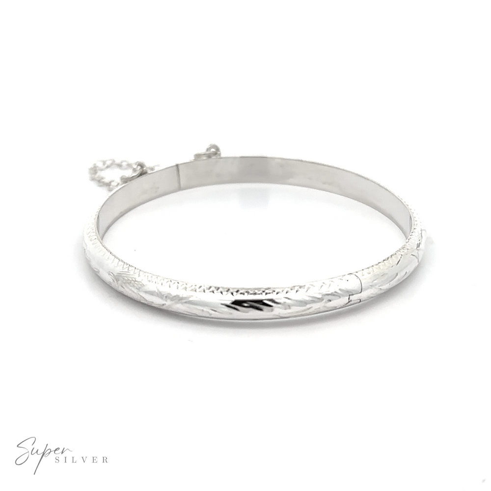 A Kids Etched Latched Bangle featuring a silver chain that makes taking it on and off easier.