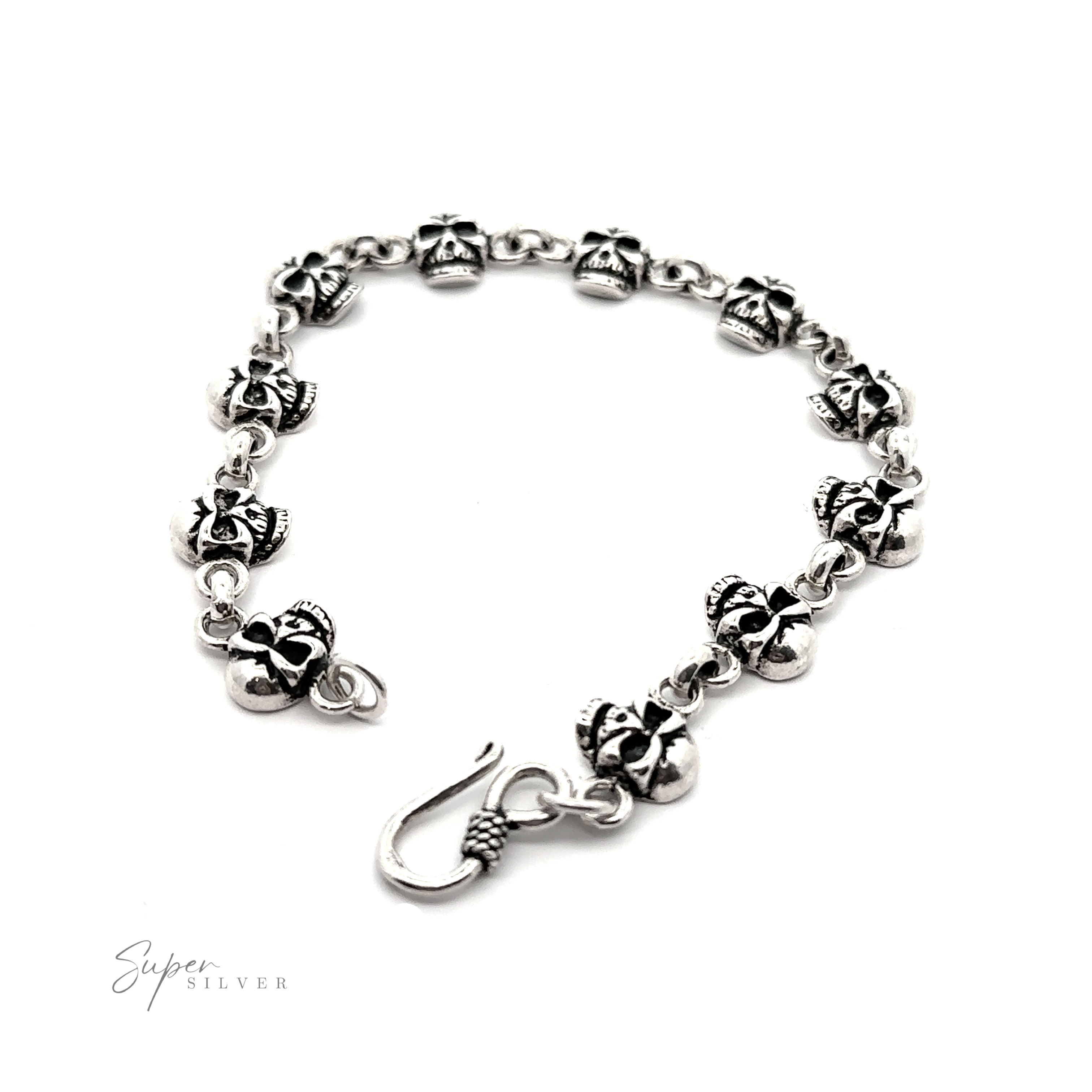 A sterling silver Skull bracelet with black and white flowers on it.