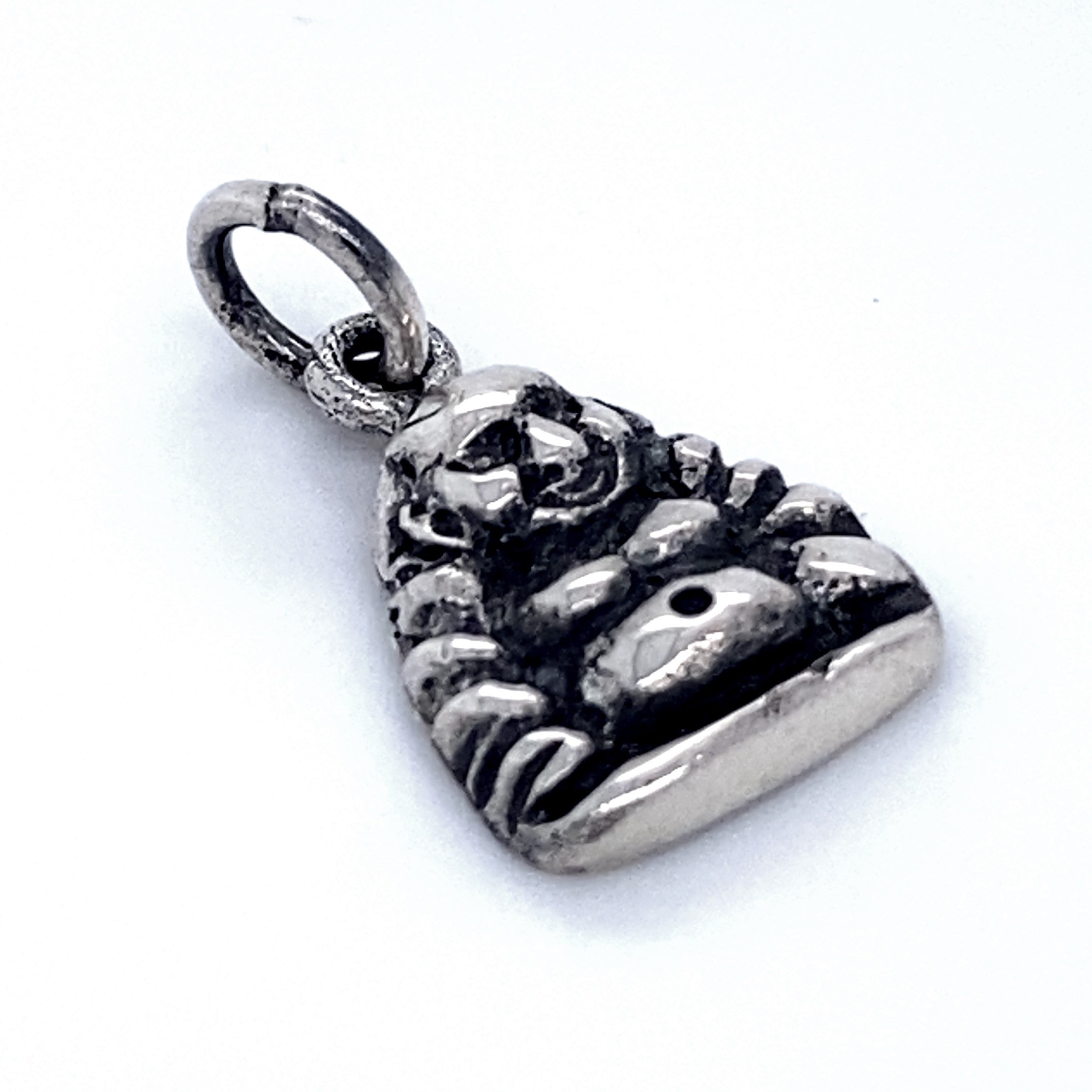 A small, Laughing Buddha Charm depicting a laughing Buddha pendant with a circular loop on top for attaching to a chain or bracelet, believed to bring good luck.