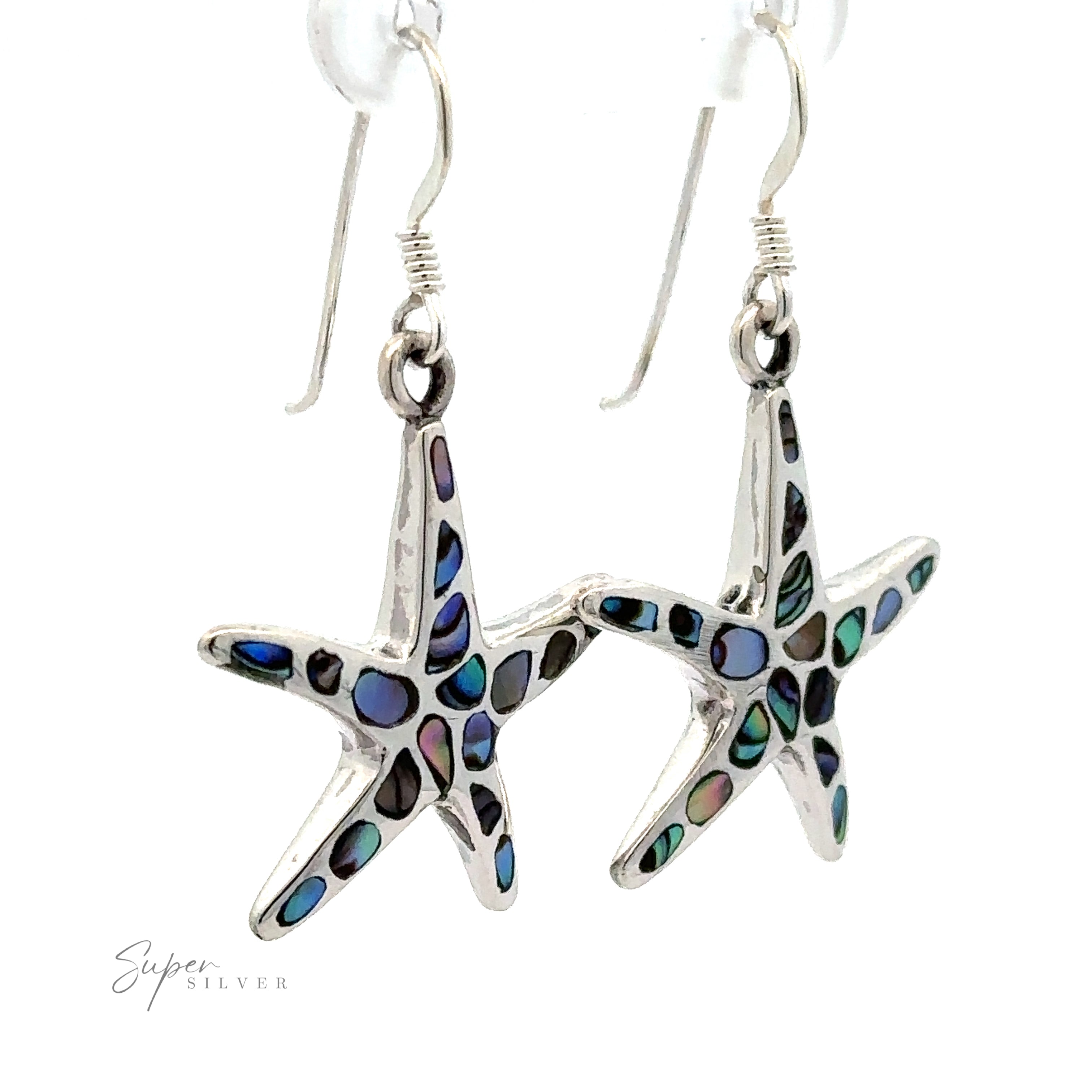 A pair of Abalone Shell Starfish Earrings with inlaid blue and green abalone shell accents, hanging from silver hooks.