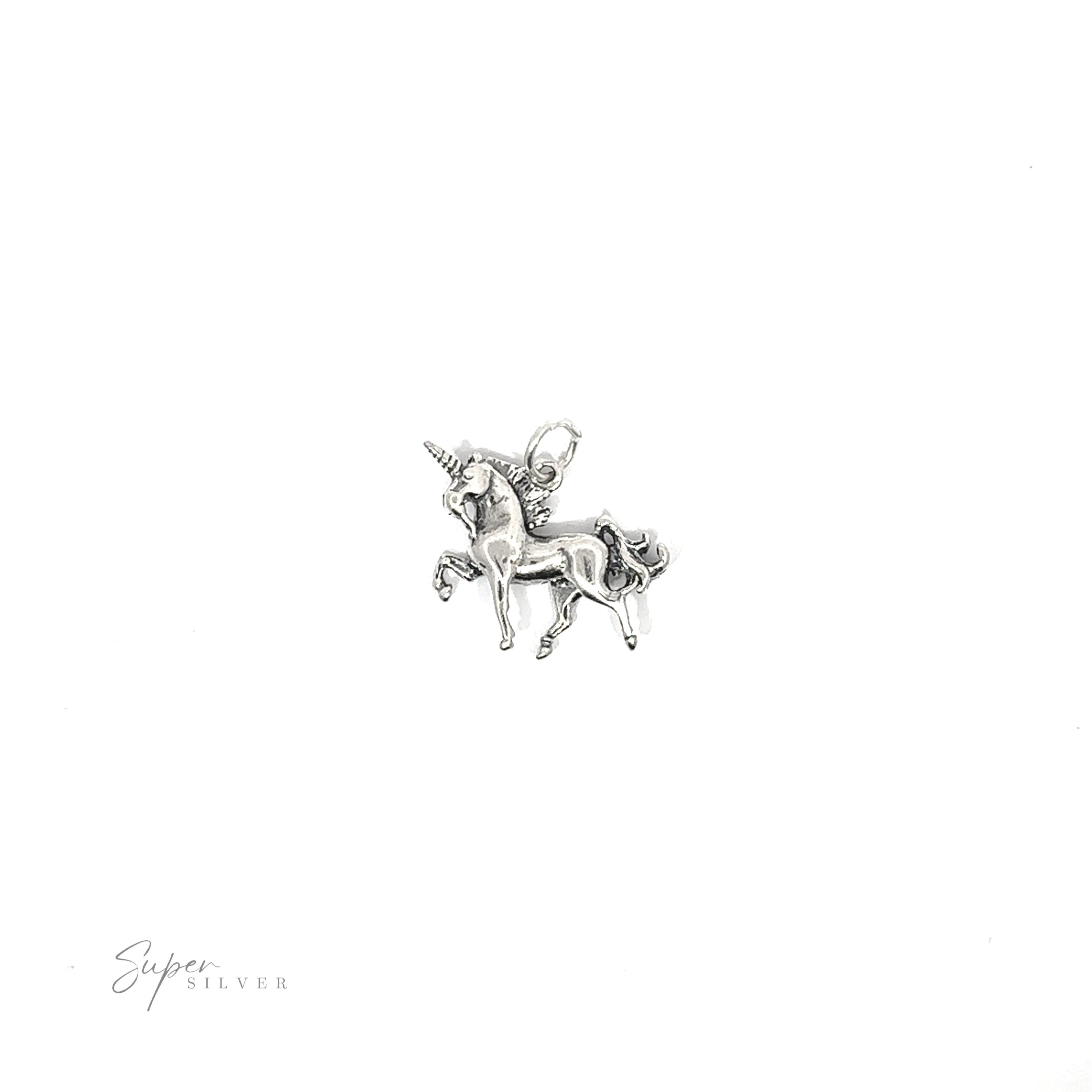 A reversible unicorn charm on a white background.