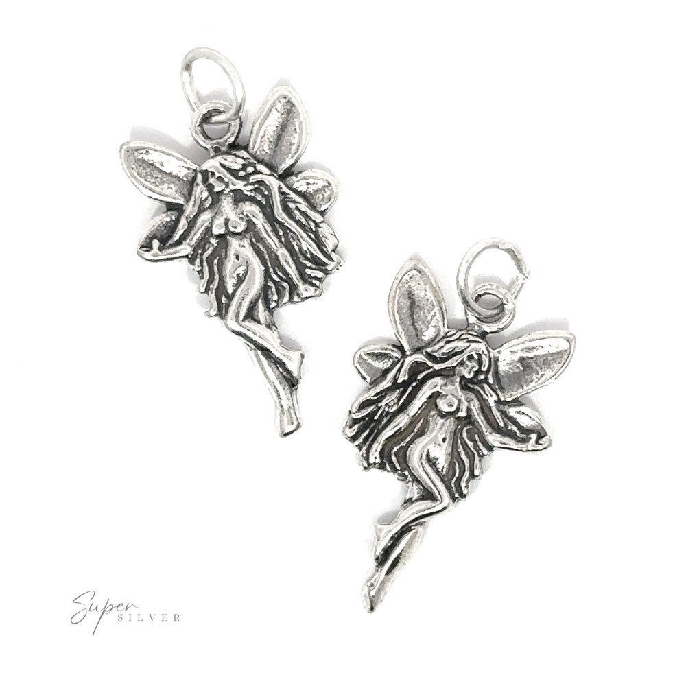 A pair of Sideways Facing Fairy Charm earrings, adorned with fairy dust for an extra touch of magic.
