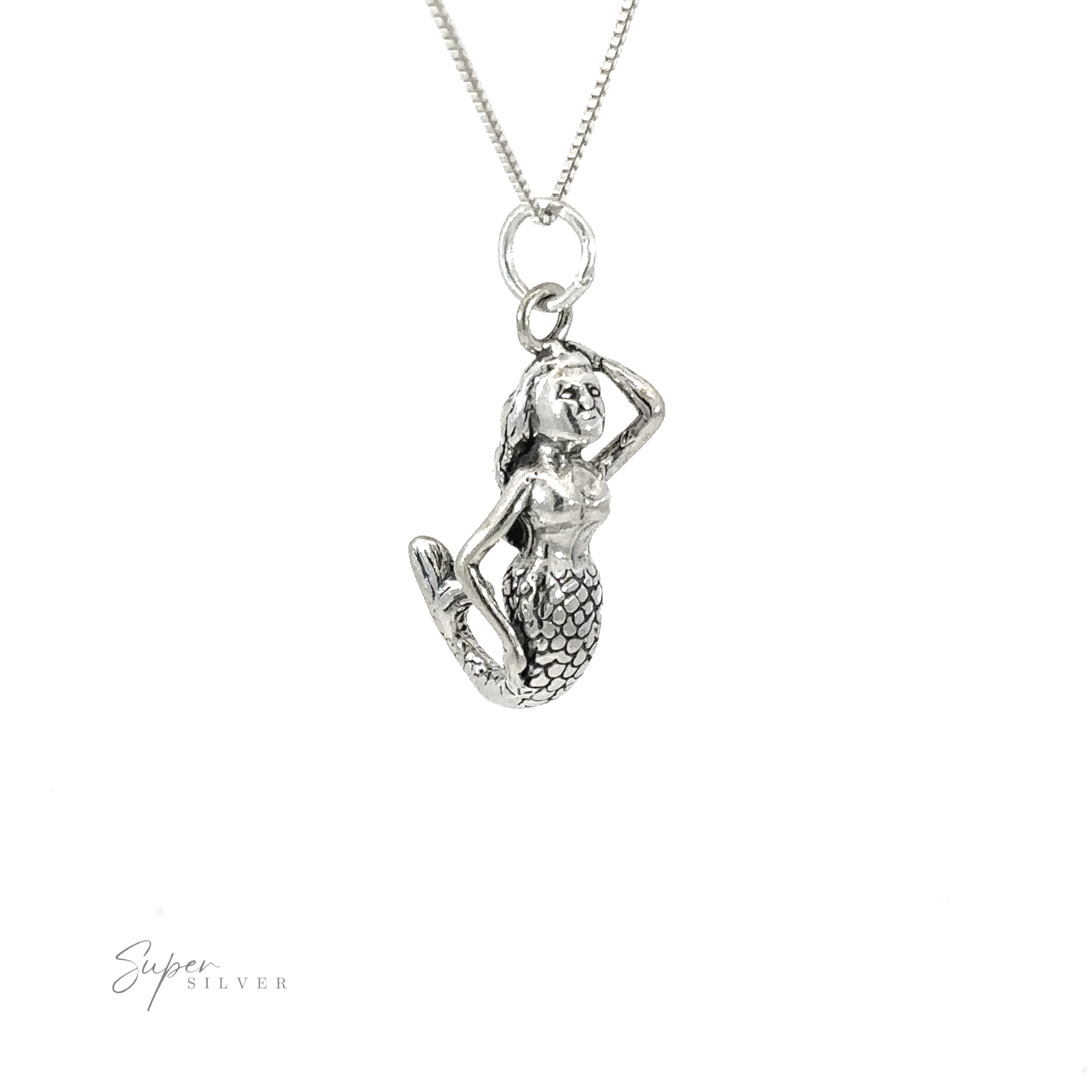 A silver necklace with a Small Mermaid Charm.