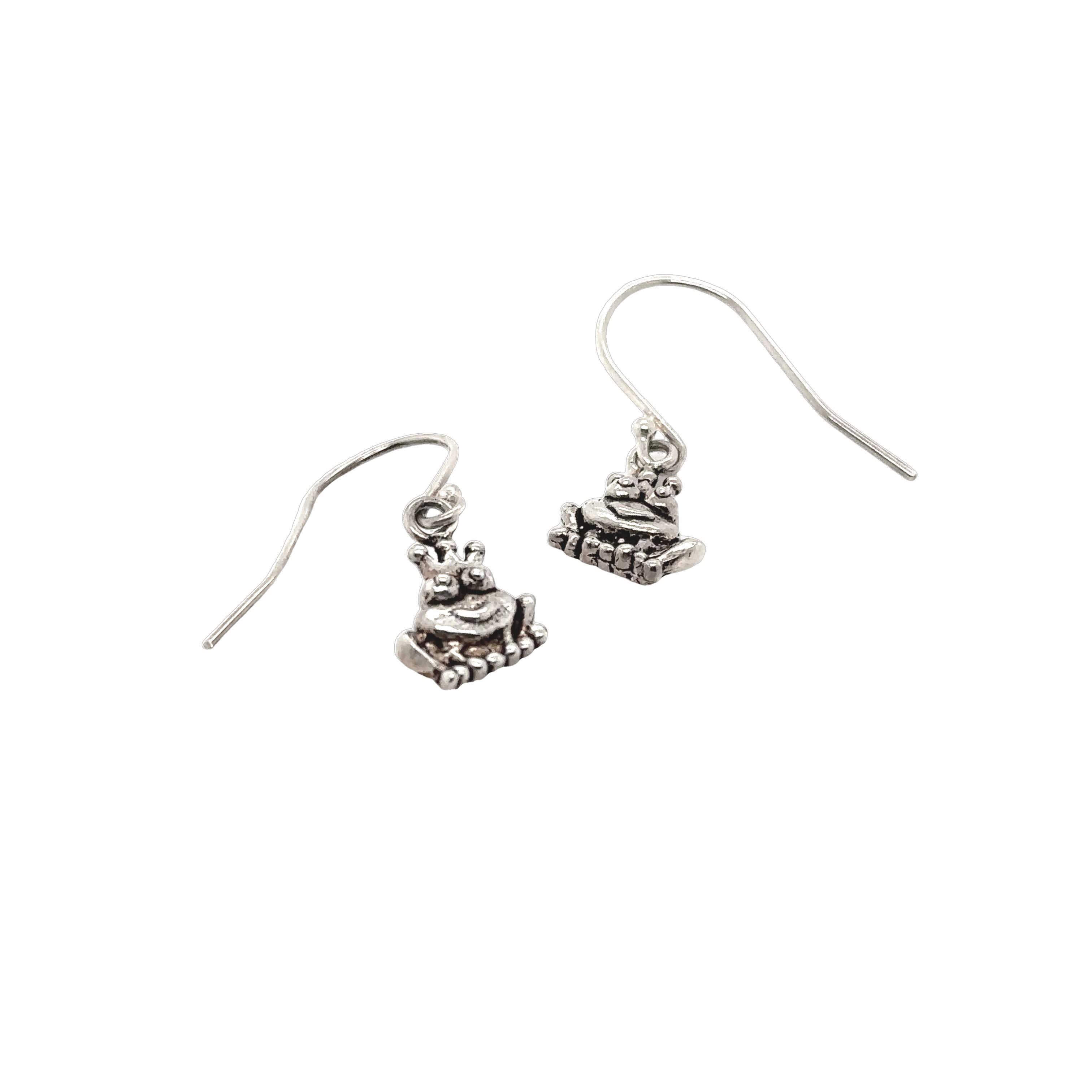 An elegant pair of Super Silver Frog Queen Earrings, adorned with a delicate bird design.