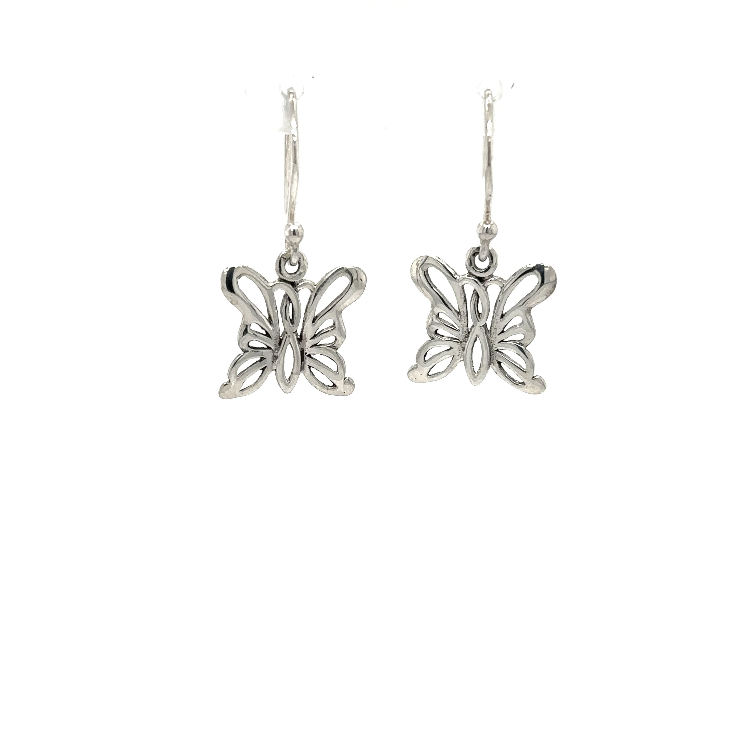 A pair of Simple Butterfly Outline Earrings by Super Silver on a white background, symbolizing hope and positivity.
