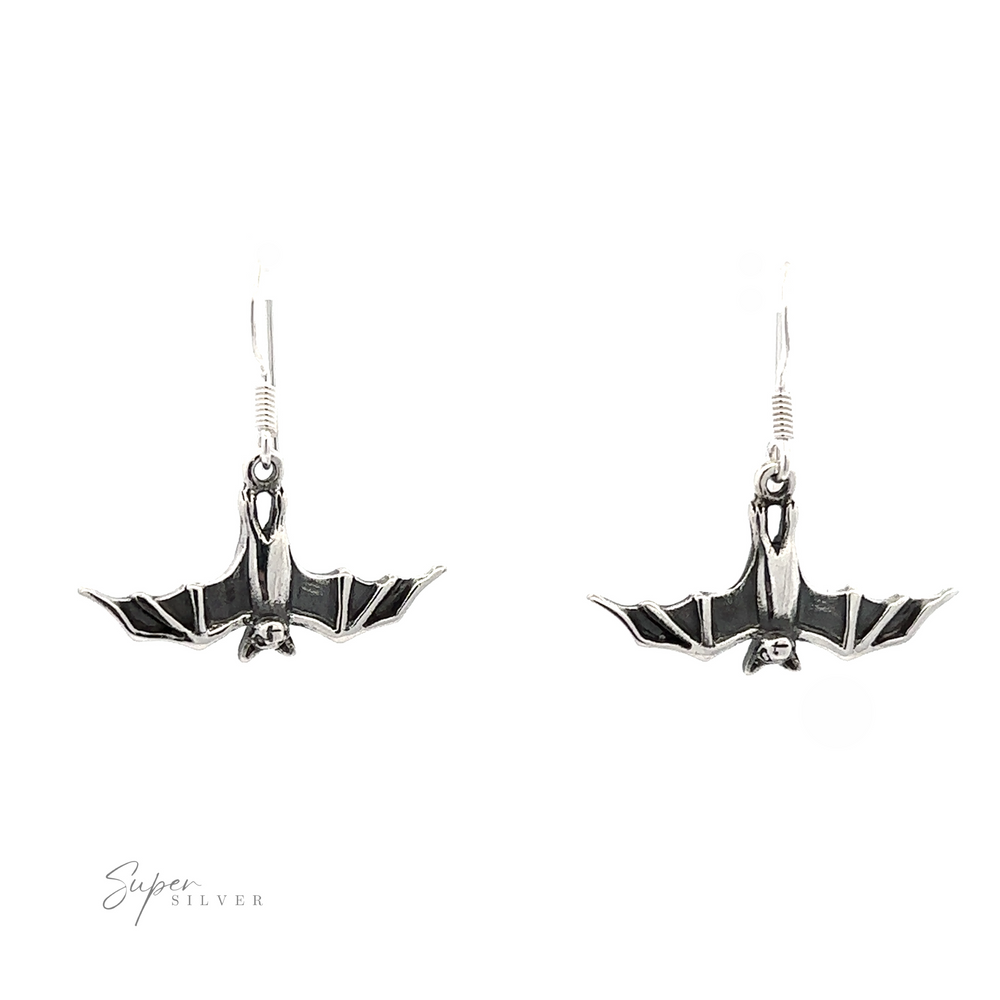 A pair of silver Hanging Bat Earrings with black accents, displayed against a white background.
