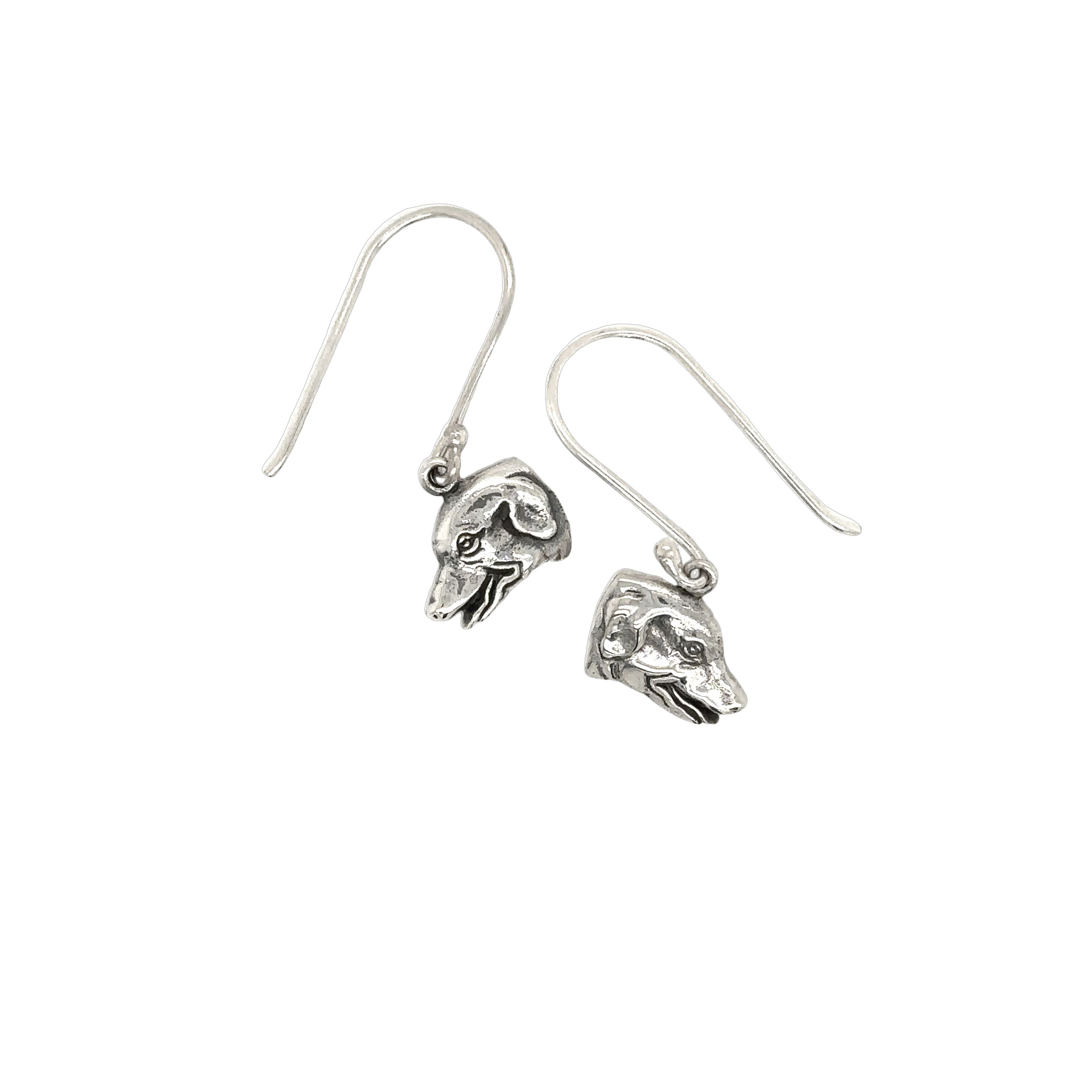 A pair of Dog Earrings by Super Silver, with a skull on them, made of .925 Silver.
