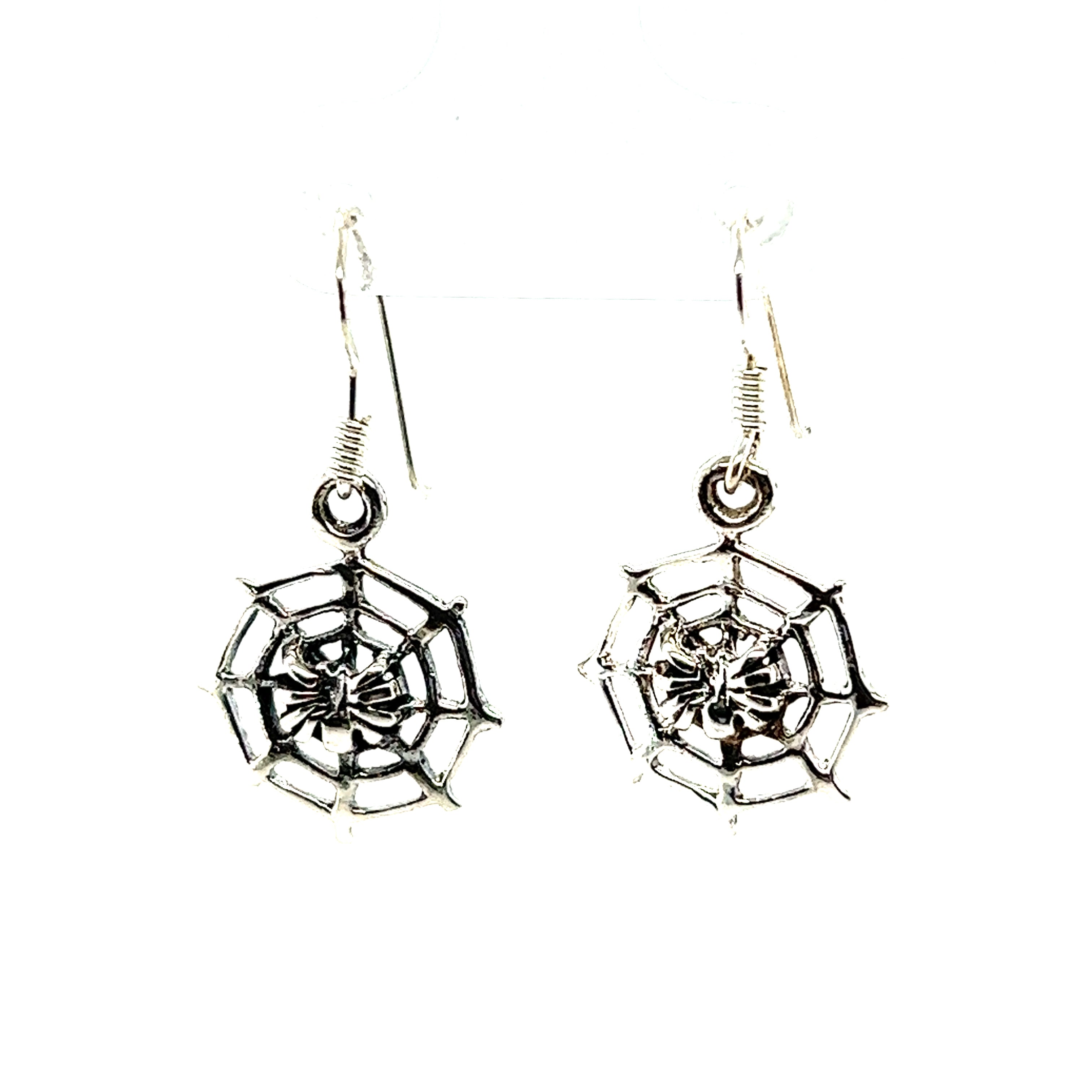 A pair of Spider in Web Earrings by Super Silver on a white background, perfect for witches and those interested in the occult.