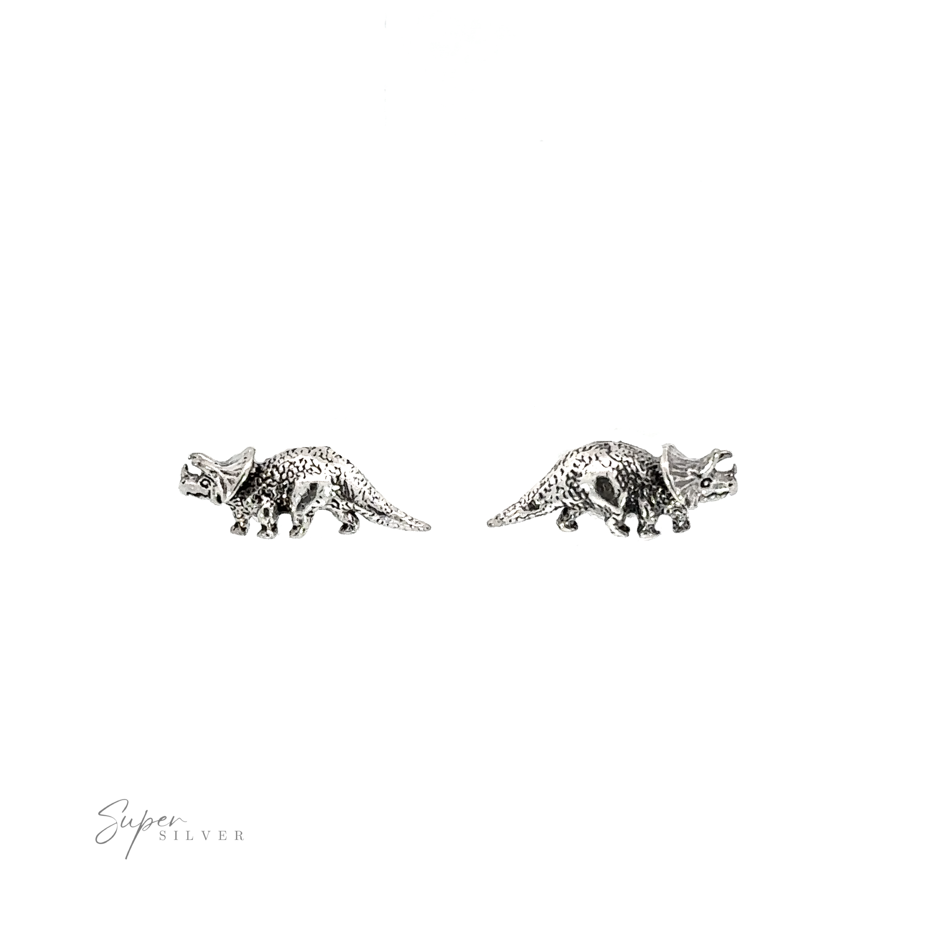 A pair of silver Triceratops Studs, the perfect prehistoric addition for any occasion, showcased on a white background.