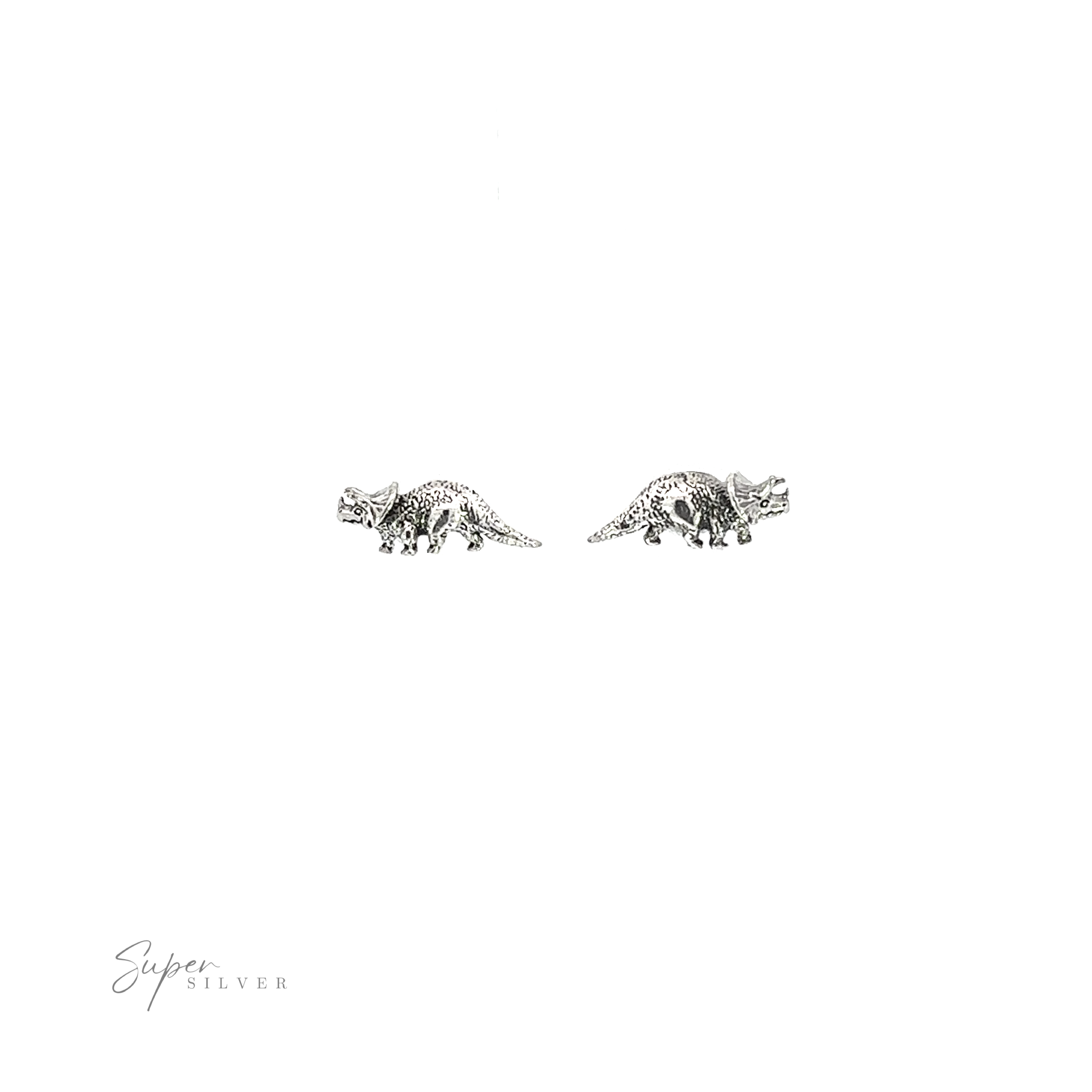 A pair of Triceratops Studs on a white background, making them a unique and prehistoric addition to any occasion.