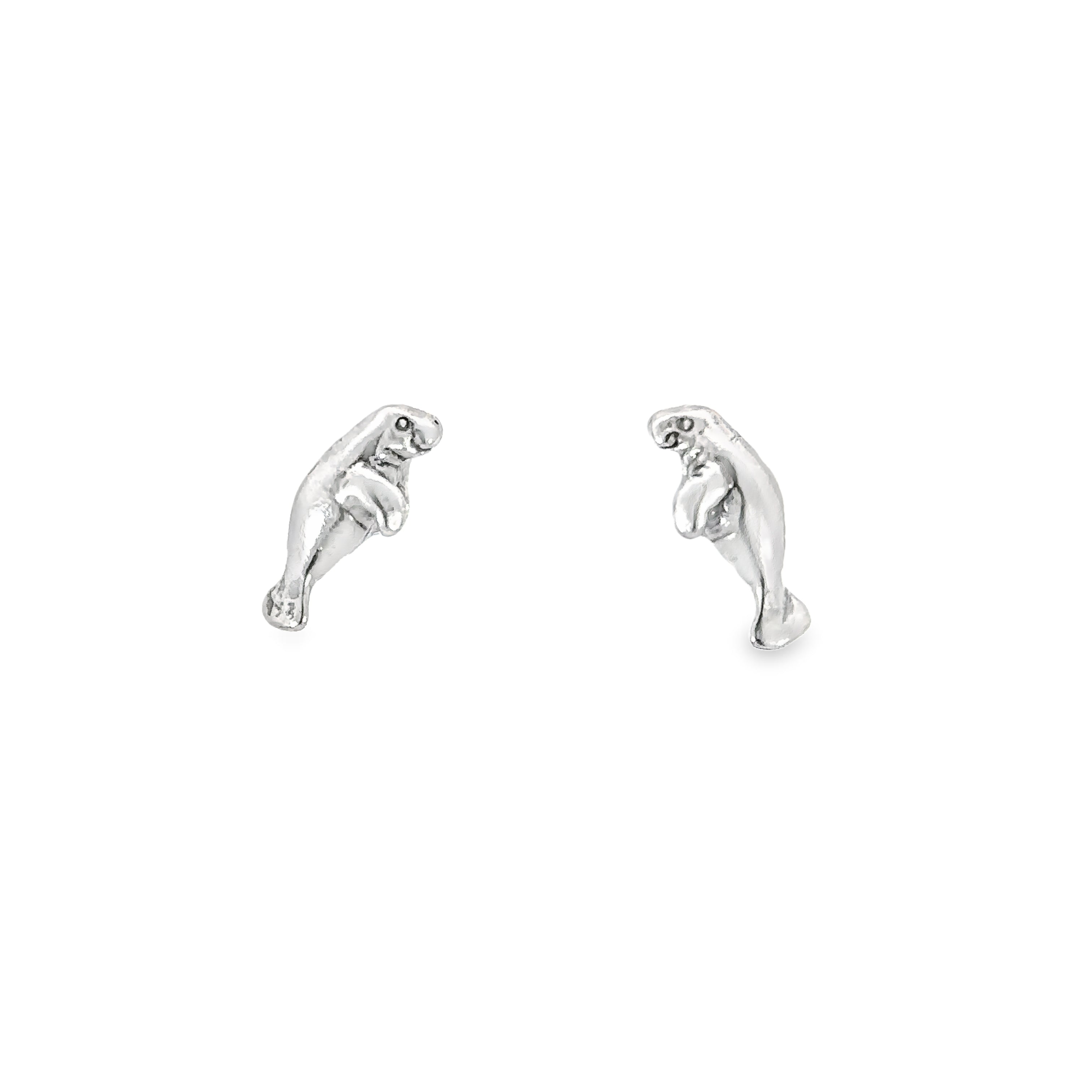 A pair of unique silver Manatee Studs on a white background.