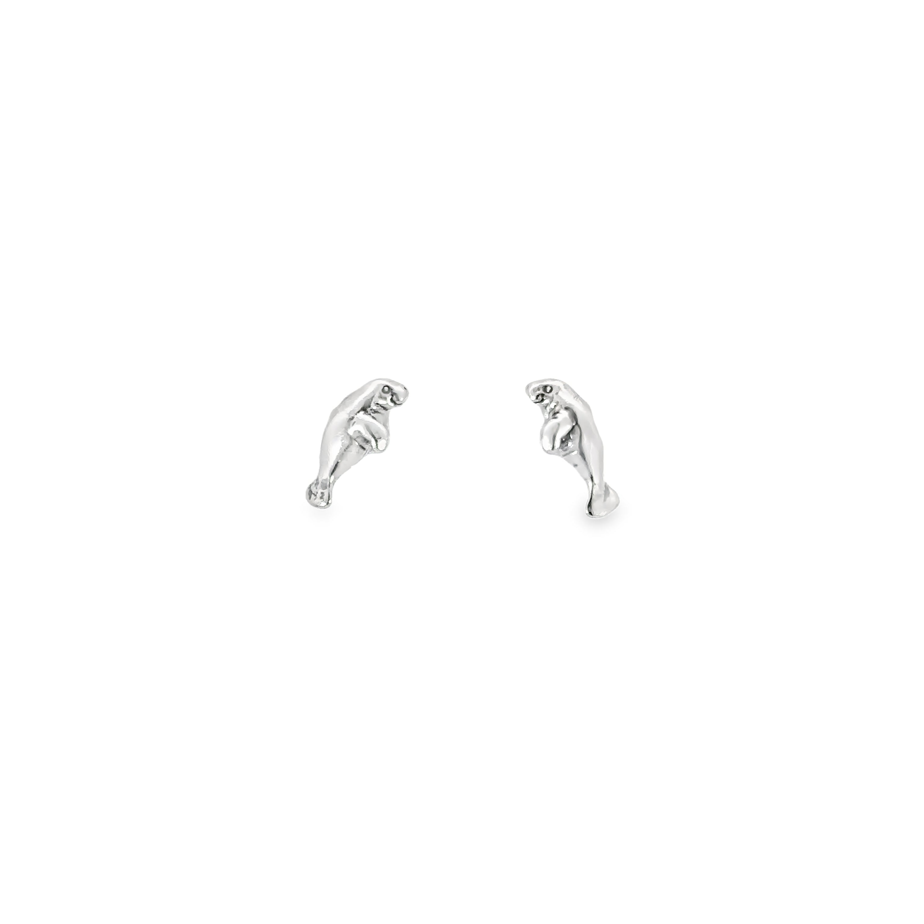 A pair of Manatee Studs on a white background, perfect for animal-loving accessory enthusiasts.