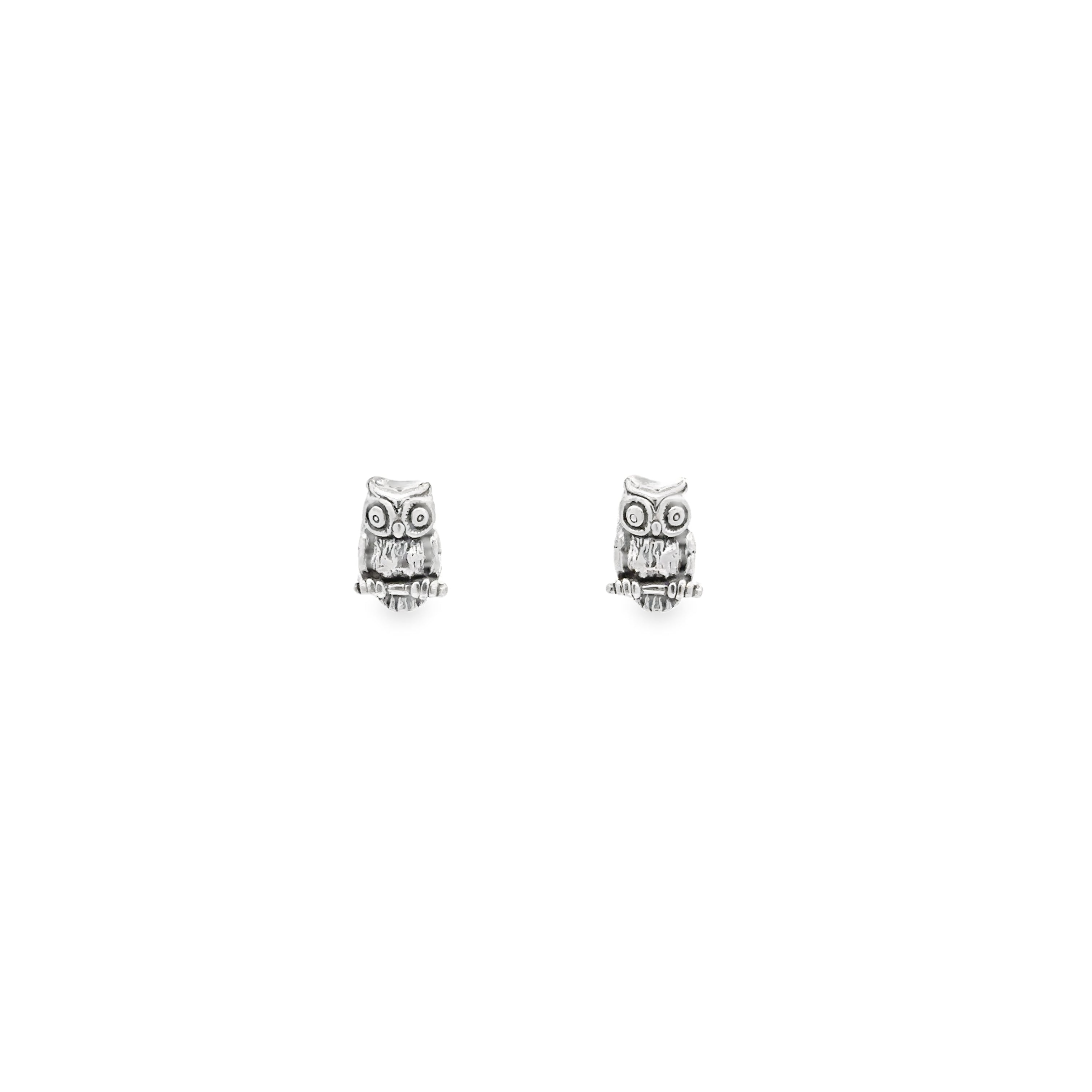 A pair of Owl Studs on a white background, showcasing wisdom.