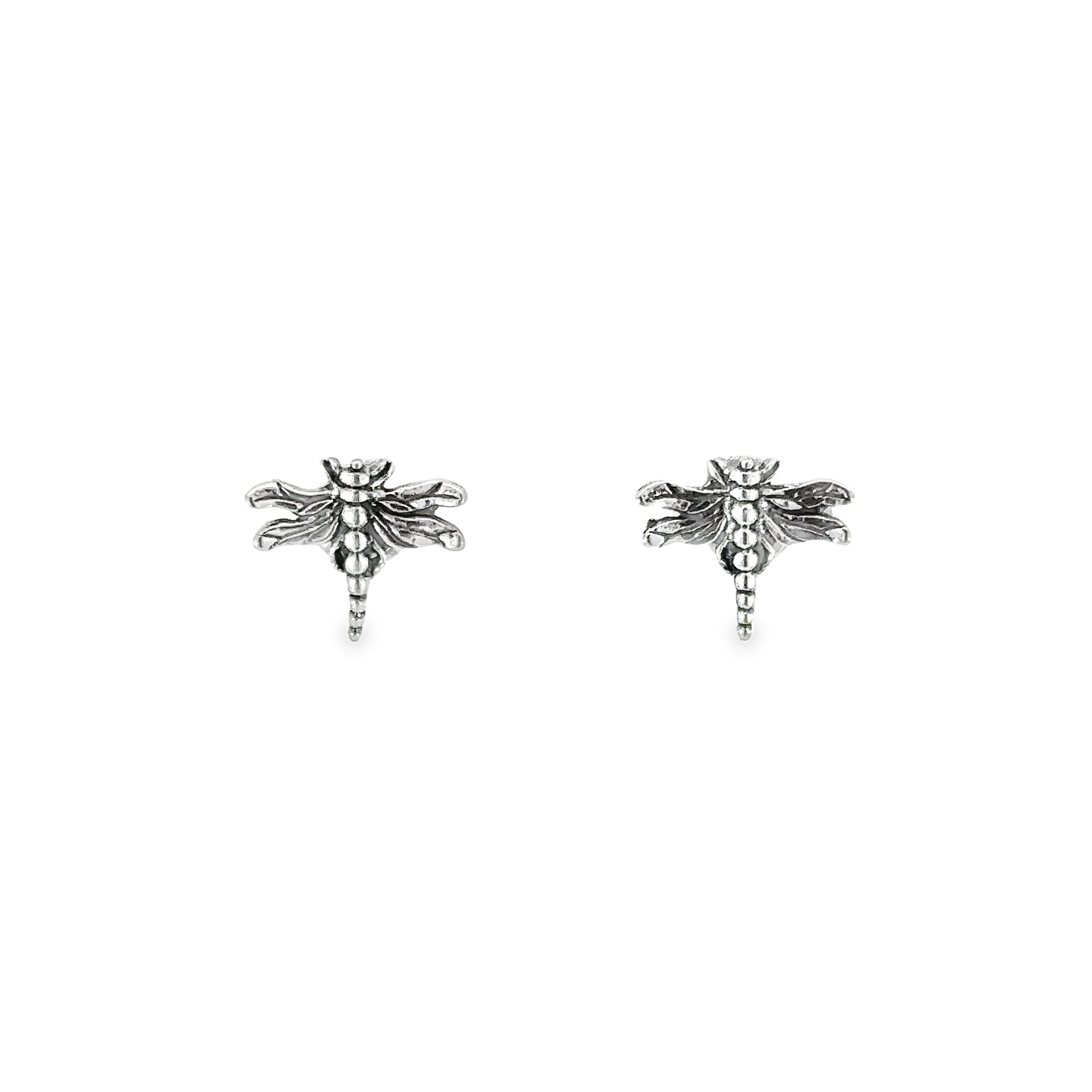 A pair of dragonfly stud earrings with detailed body on a white background.