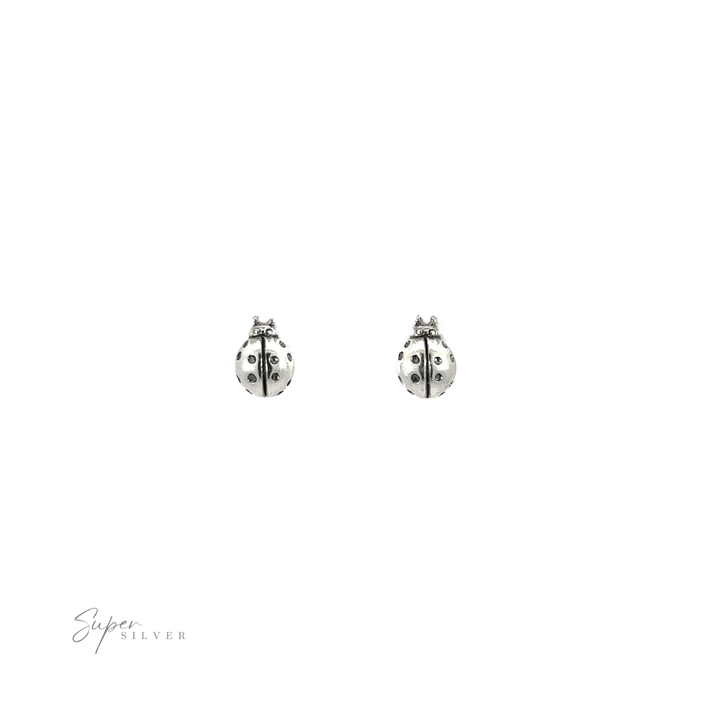 
                  
                    A pair of Ladybug Studs on a white background.
                  
                