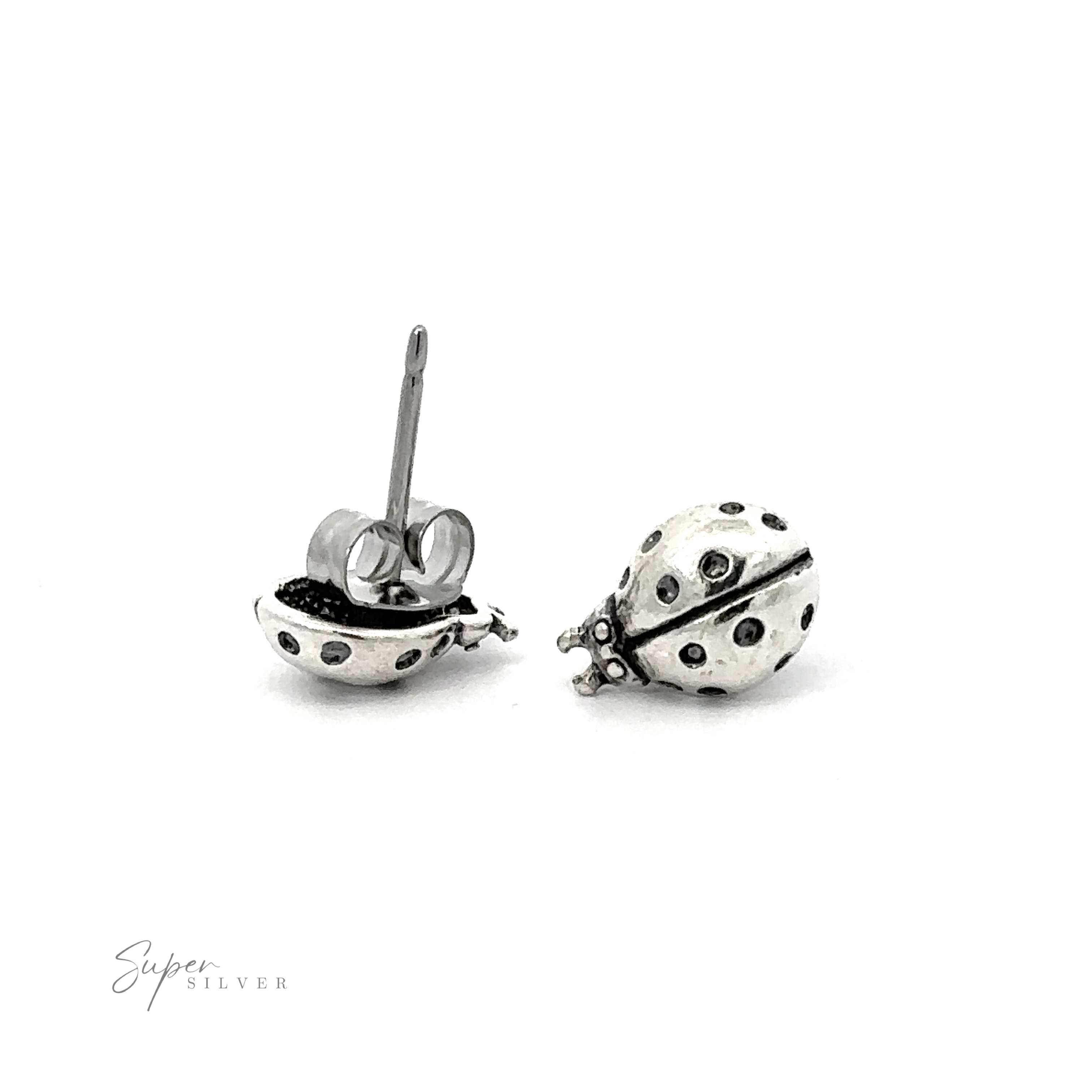 A pair of Ladybug Studs on a white background.