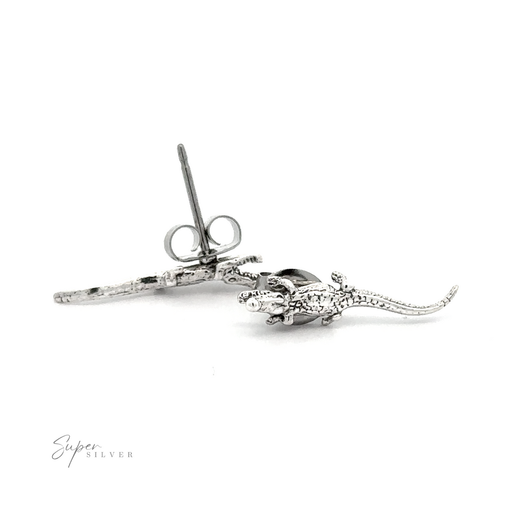 Crocodile Studs on a white background made of .925 Sterling Silver.
