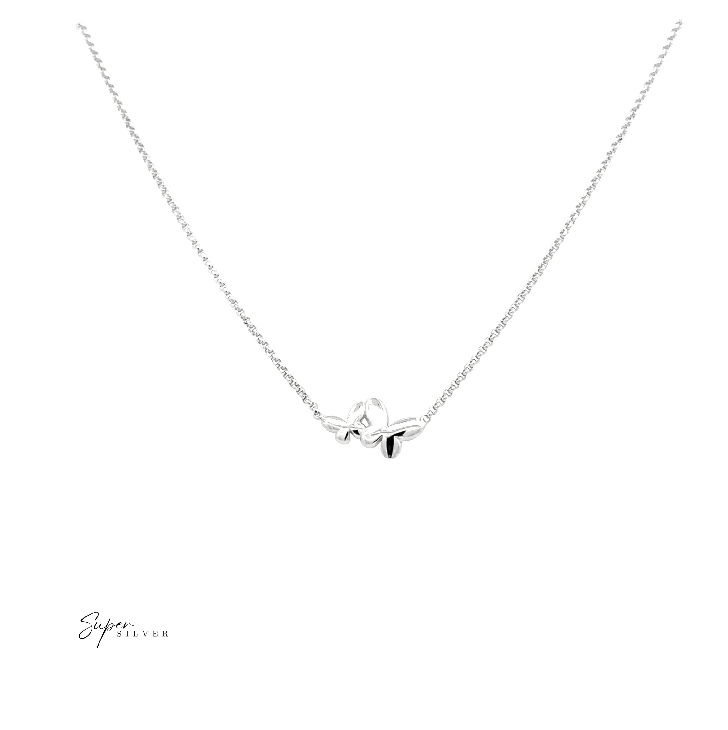 The Dainty Double Butterfly Necklace is an Italian silver piece with a rhodium finish, featuring two small butterfly pendants on a fine chain, shown against a white background.