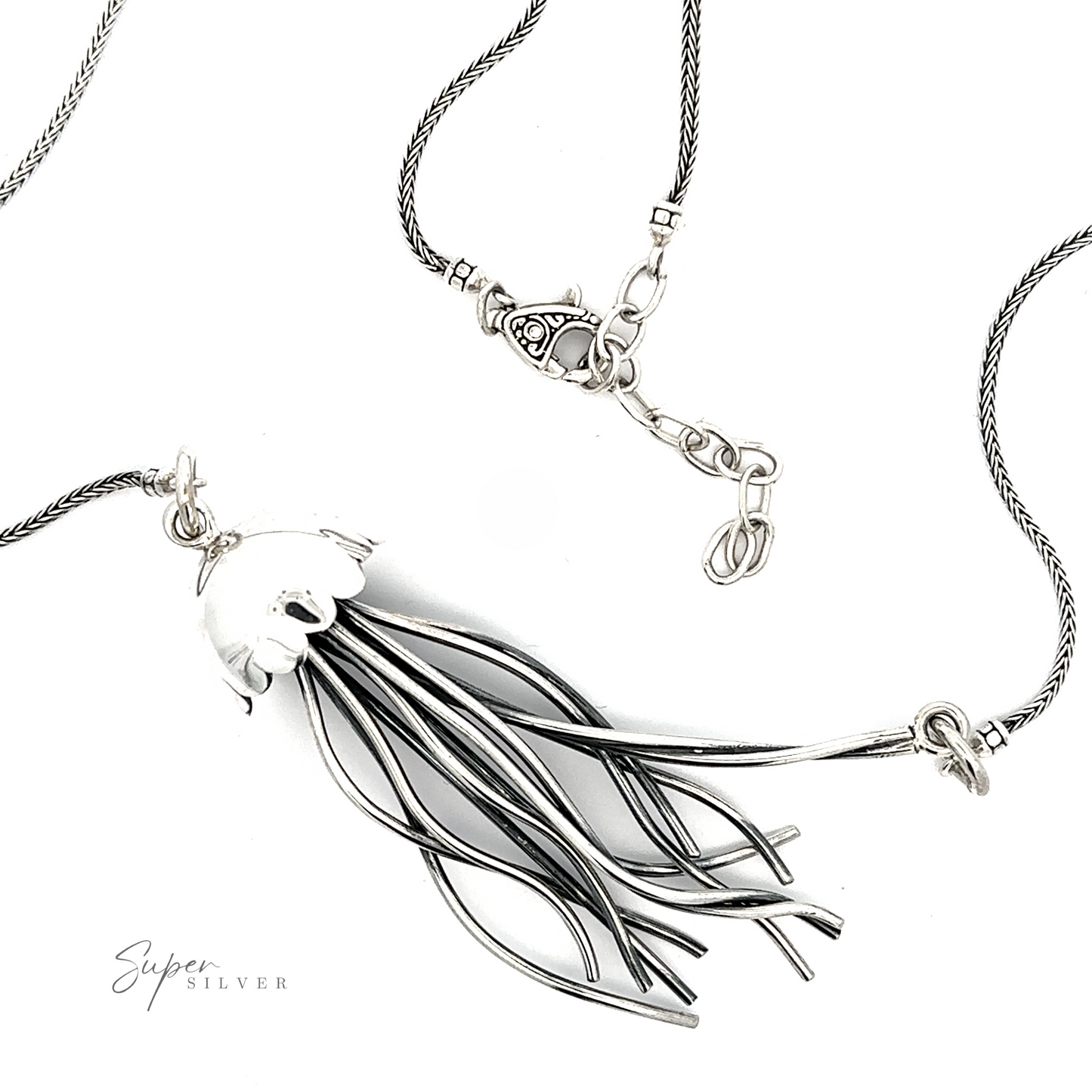 Jellyfish necklace featuring a pendant with a stylized, elongated bird design, displayed on a light background with a signature in the corner.