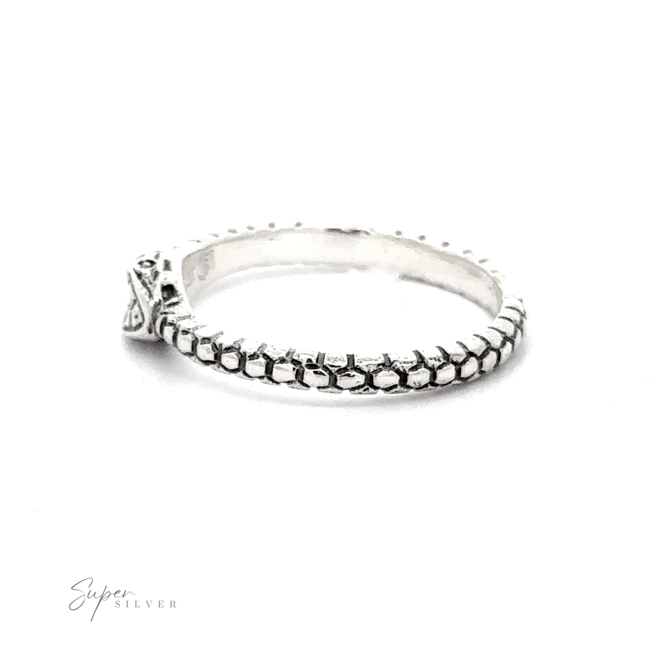 Ouroboros Ring with intricate detailing and a clear gemstone set in a decorative mount on a white background.