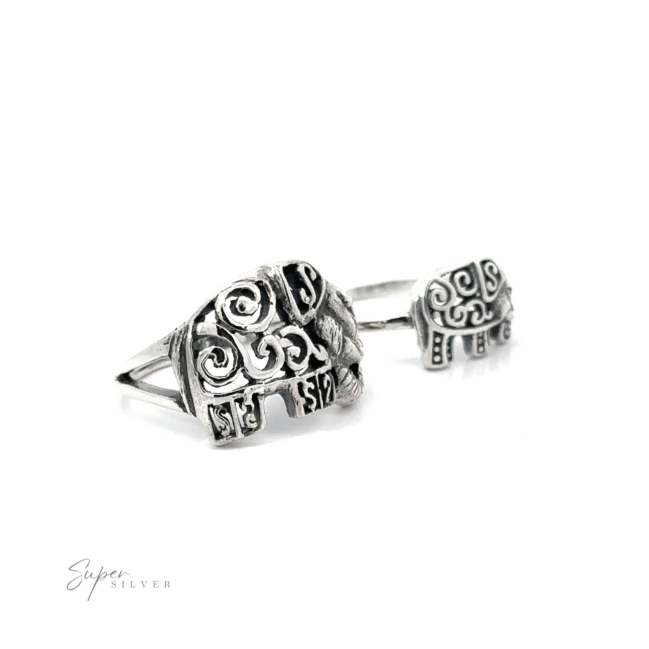 A pair of Filigree Elephant Rings with intricate swirl designs displayed against a white background.