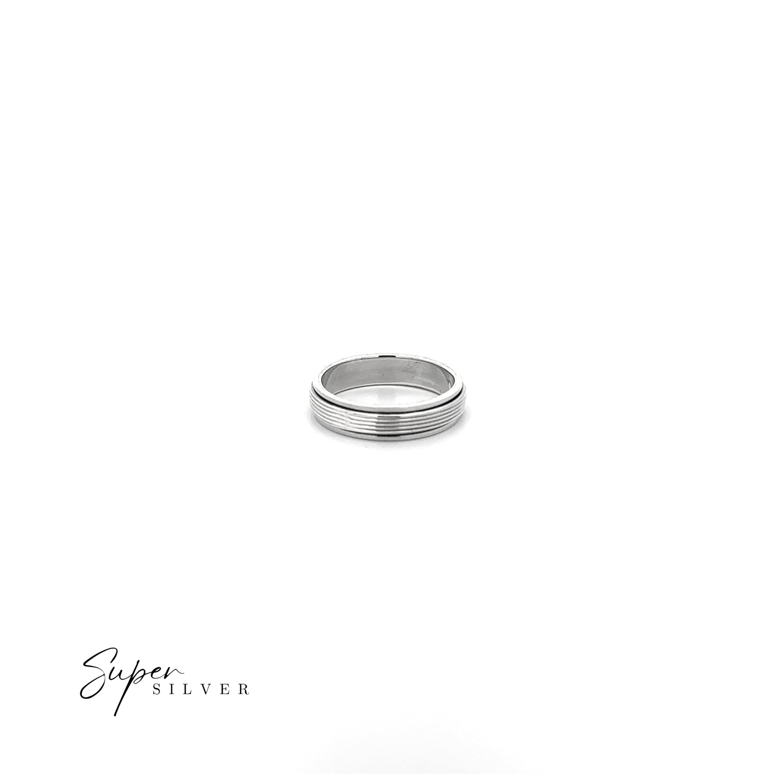 A Striped Spinner Band in sterling silver, featuring a grooved design, is centered on a white background. The words "Super Silver" in the lower left emphasize the calming and stylish appeal of this Done-Jen 11/7 ring.