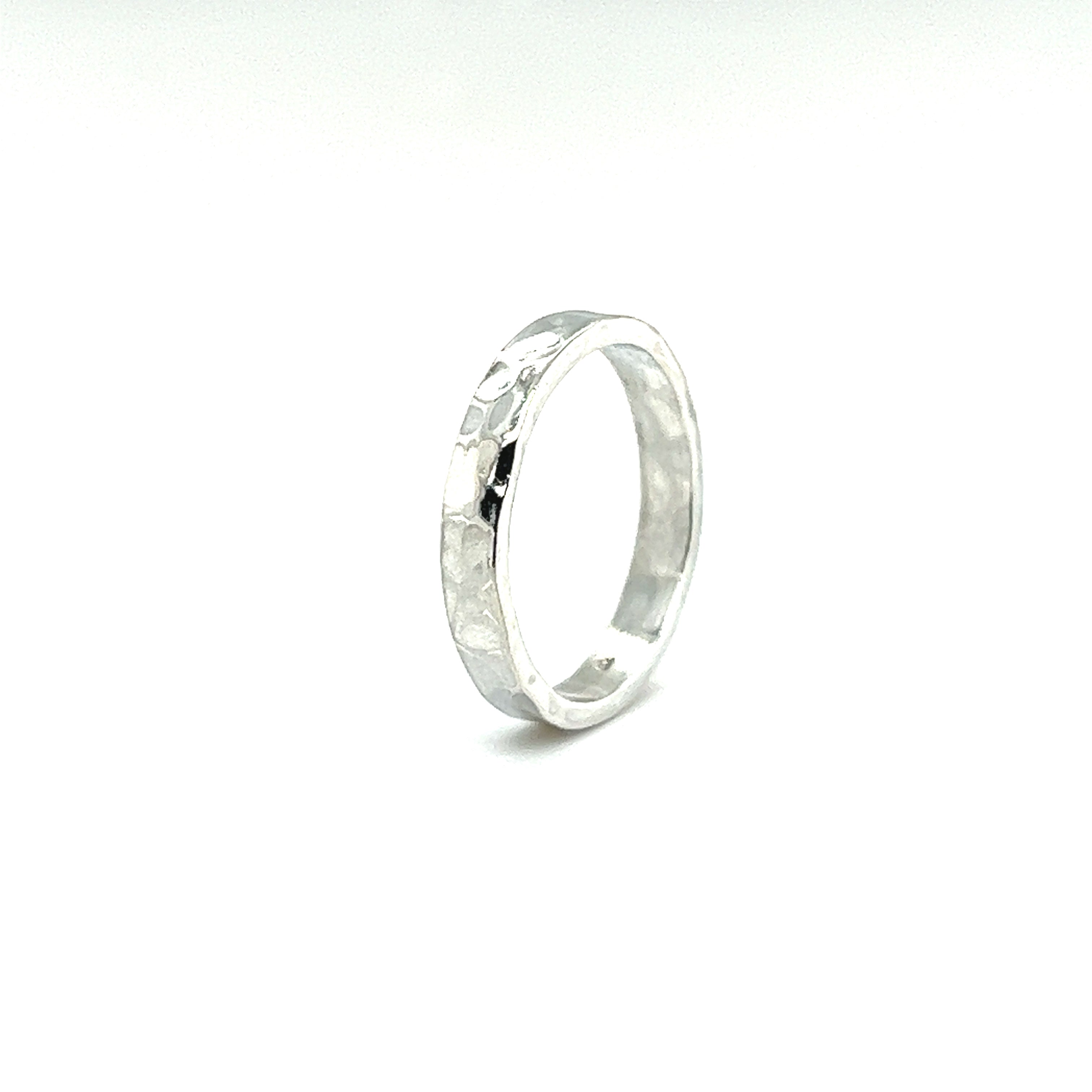 A Super Silver 3mm Flat Hammered Band with a contemporary twist.