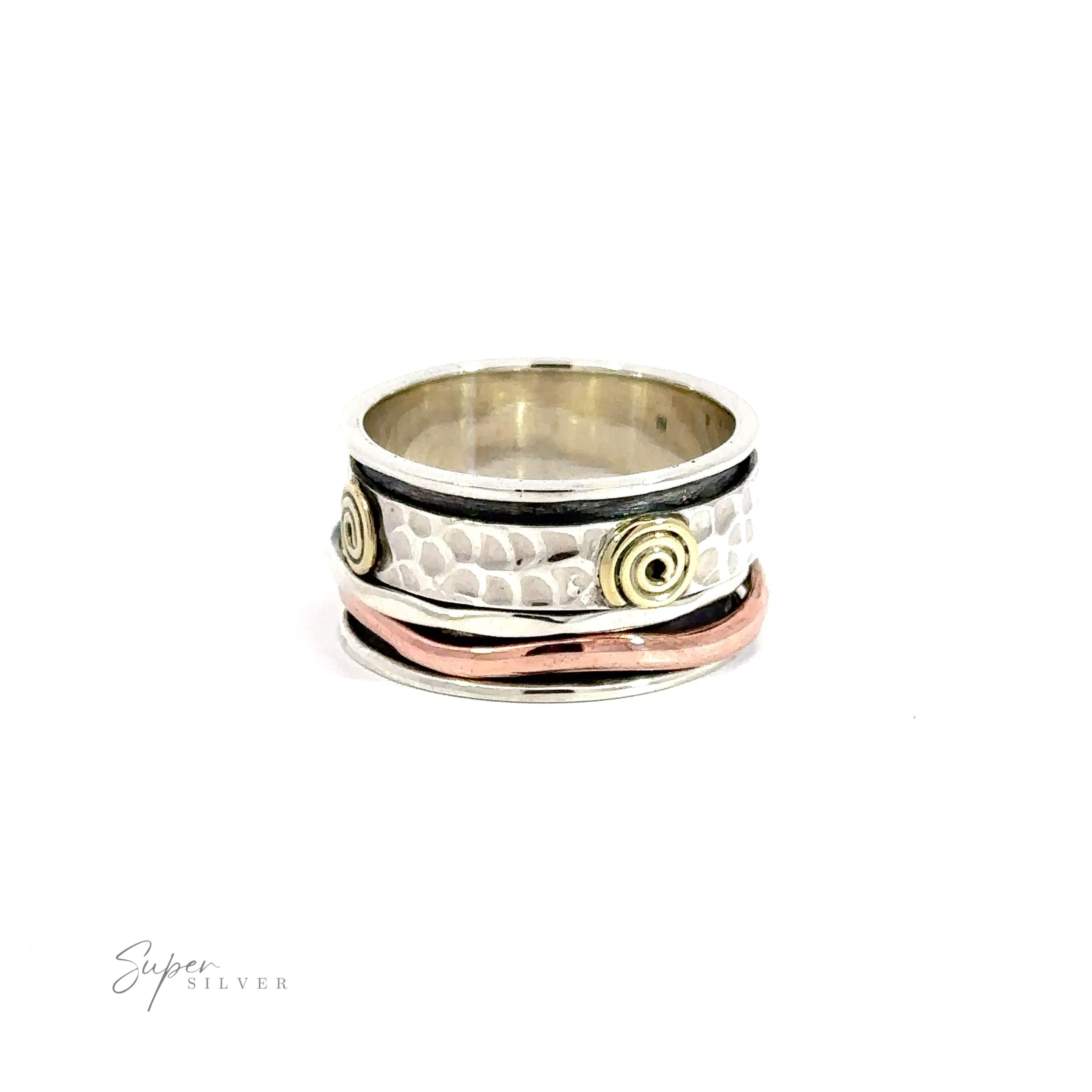 A Handmade Spinner Ring with Copper and Gold Spirals featuring a hammered silver band and rose gold spiral accents.