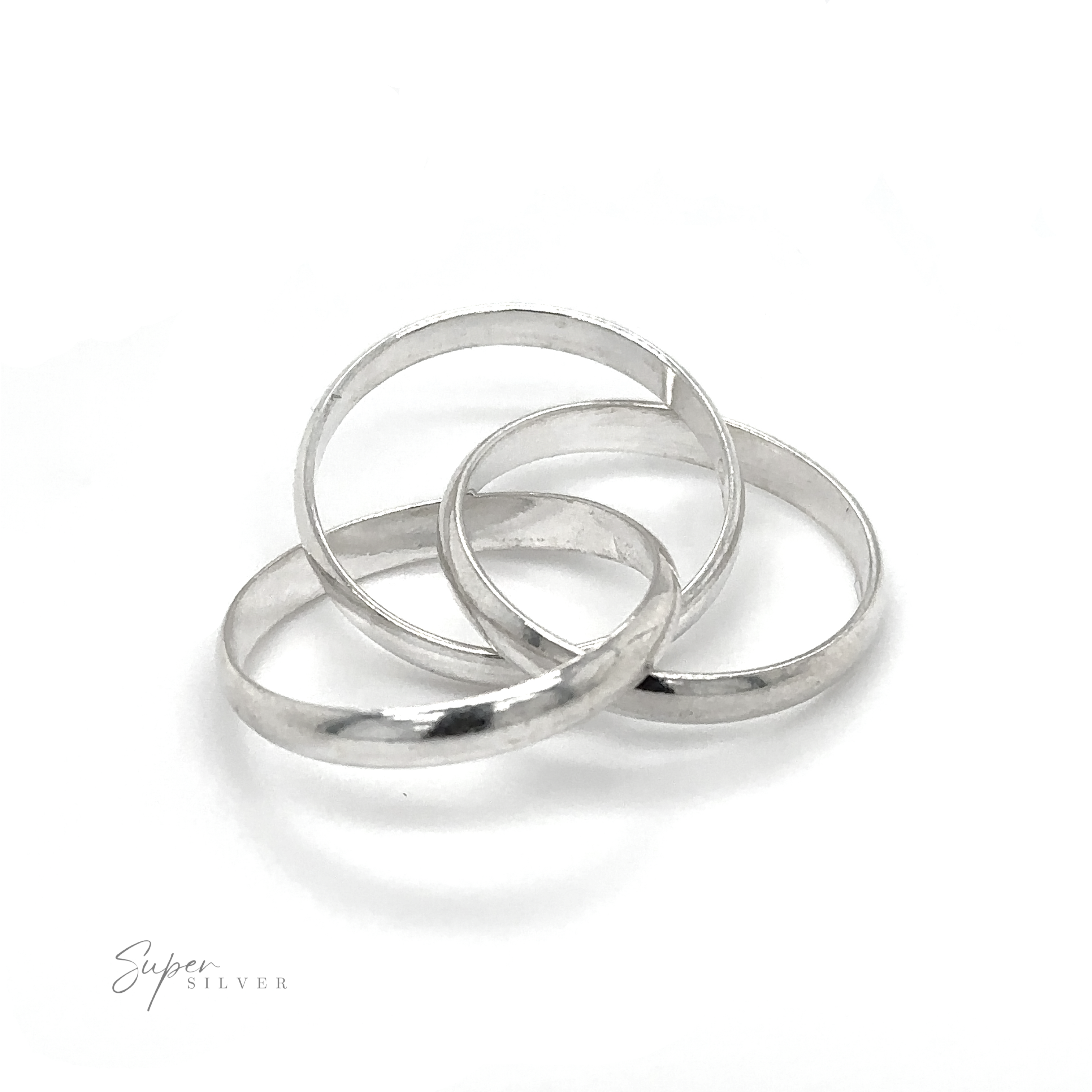 Three Three Ring Rolling Bands, symbolizing devotion, placed on a white surface.