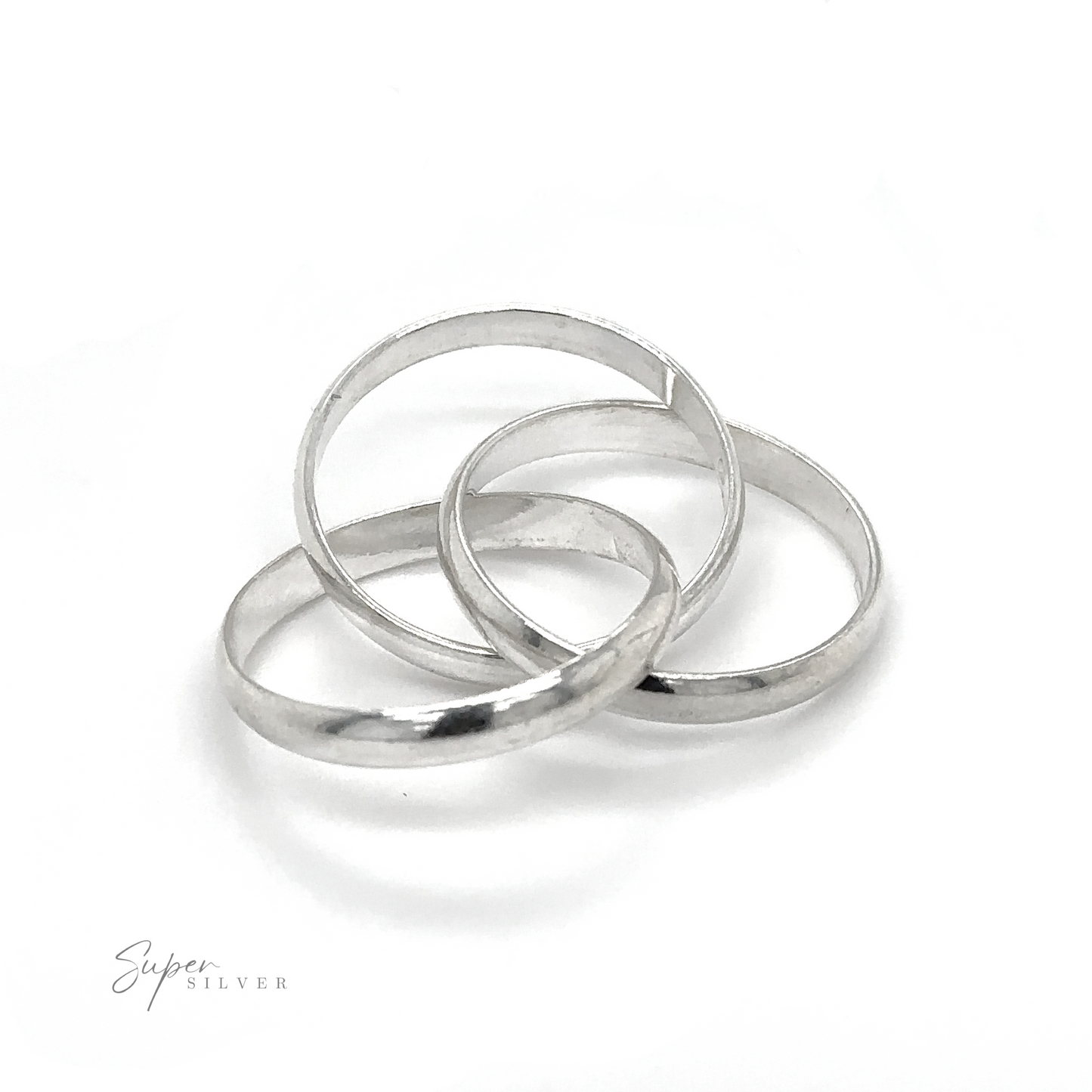 
                  
                    Three Three Ring Rolling Bands, symbolizing devotion, placed on a white surface.
                  
                