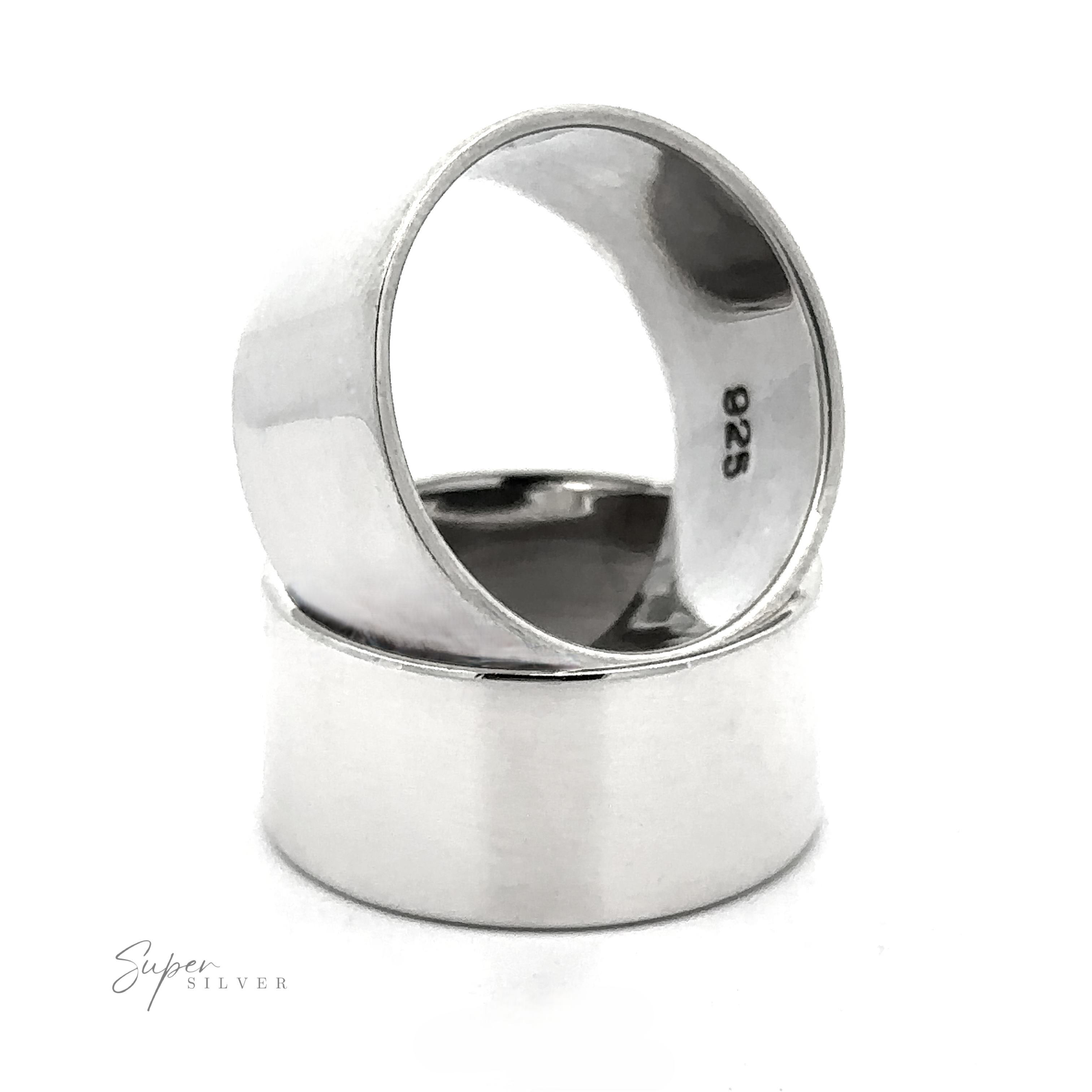 Two wide, plain .925 Sterling Silver rings from The Flat Band XL collection are stacked—one upright, one sideways—showing a "925" stamp inside. Their bold flat band design stands out against the white background with a faint "Super Silver" logo.