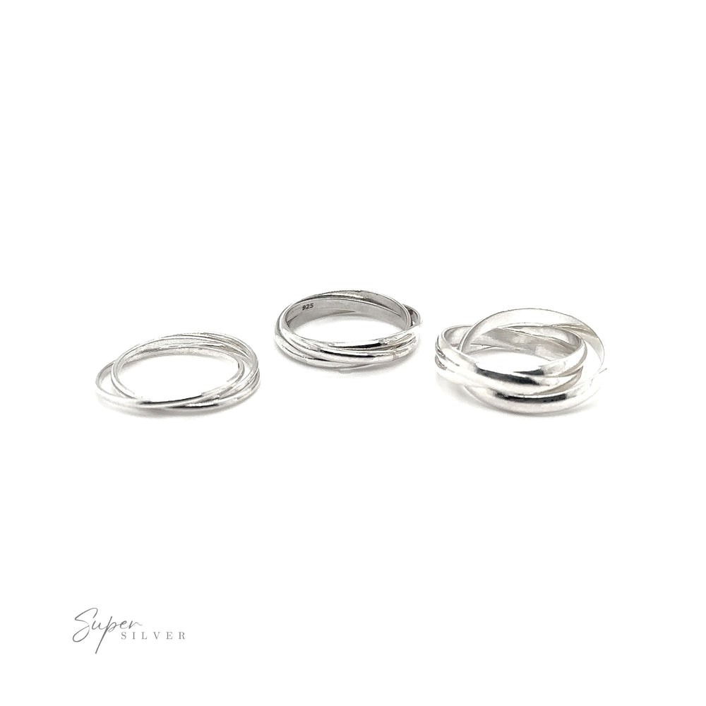 
                  
                    A set of Three Ring Rolling Bands showcasing devotion and symbolism, placed on a pristine white background.
                  
                