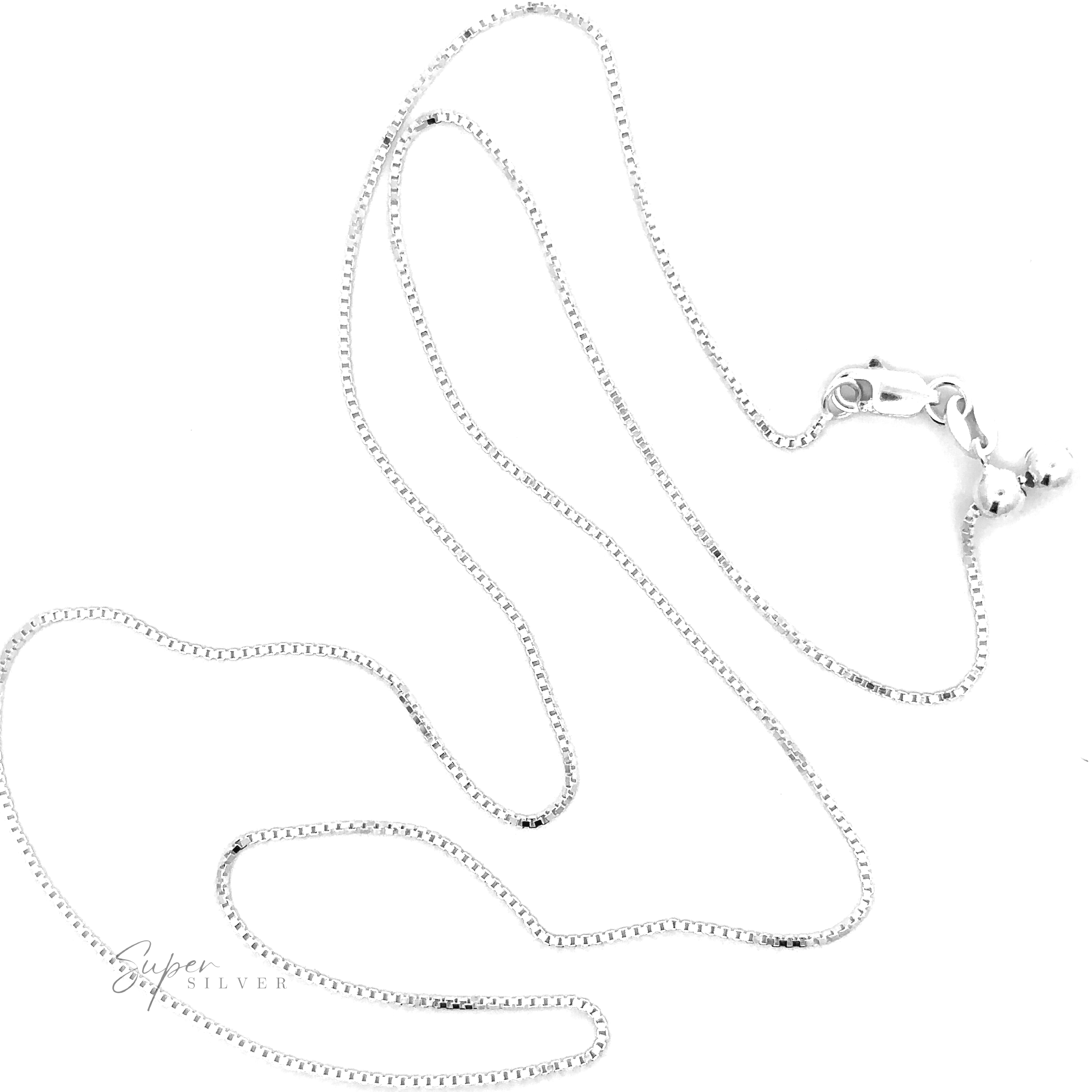 An Adjustable Silver Box Chain necklace, featuring a sterling silver clasp and two small attached balls, lies against a white background. The adjustable length allows for effortless layering of necklaces. The "Super Silver" logo is visible in the bottom left corner.