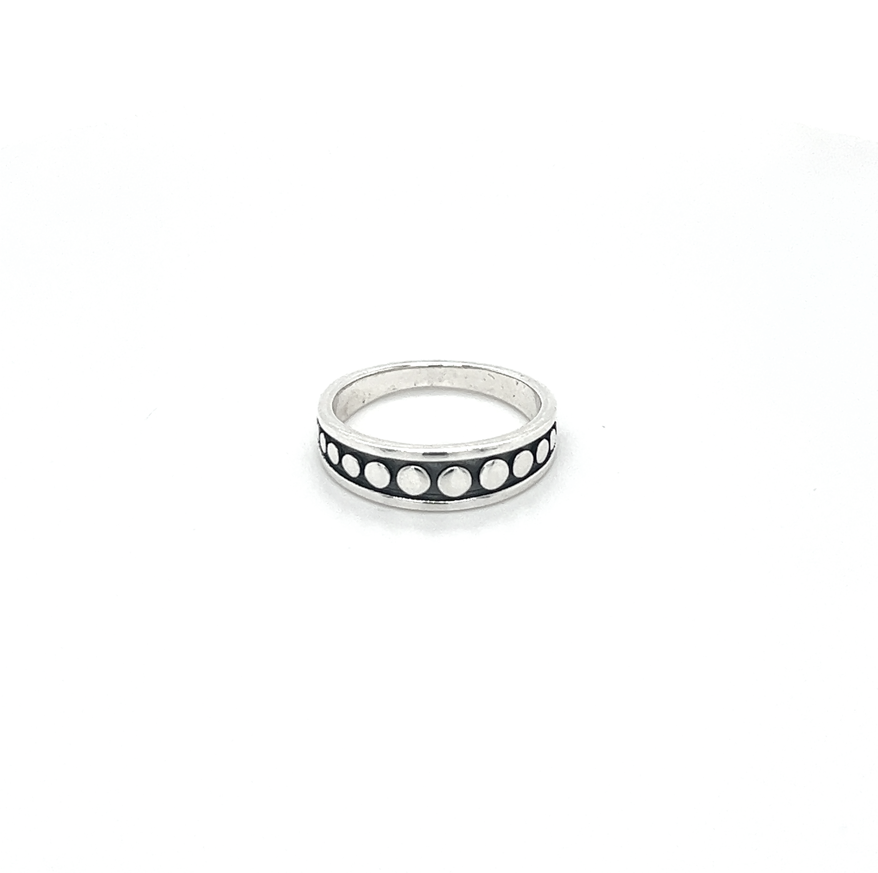 A sterling silver Moon Phase Band Ring with an oxidized finish.