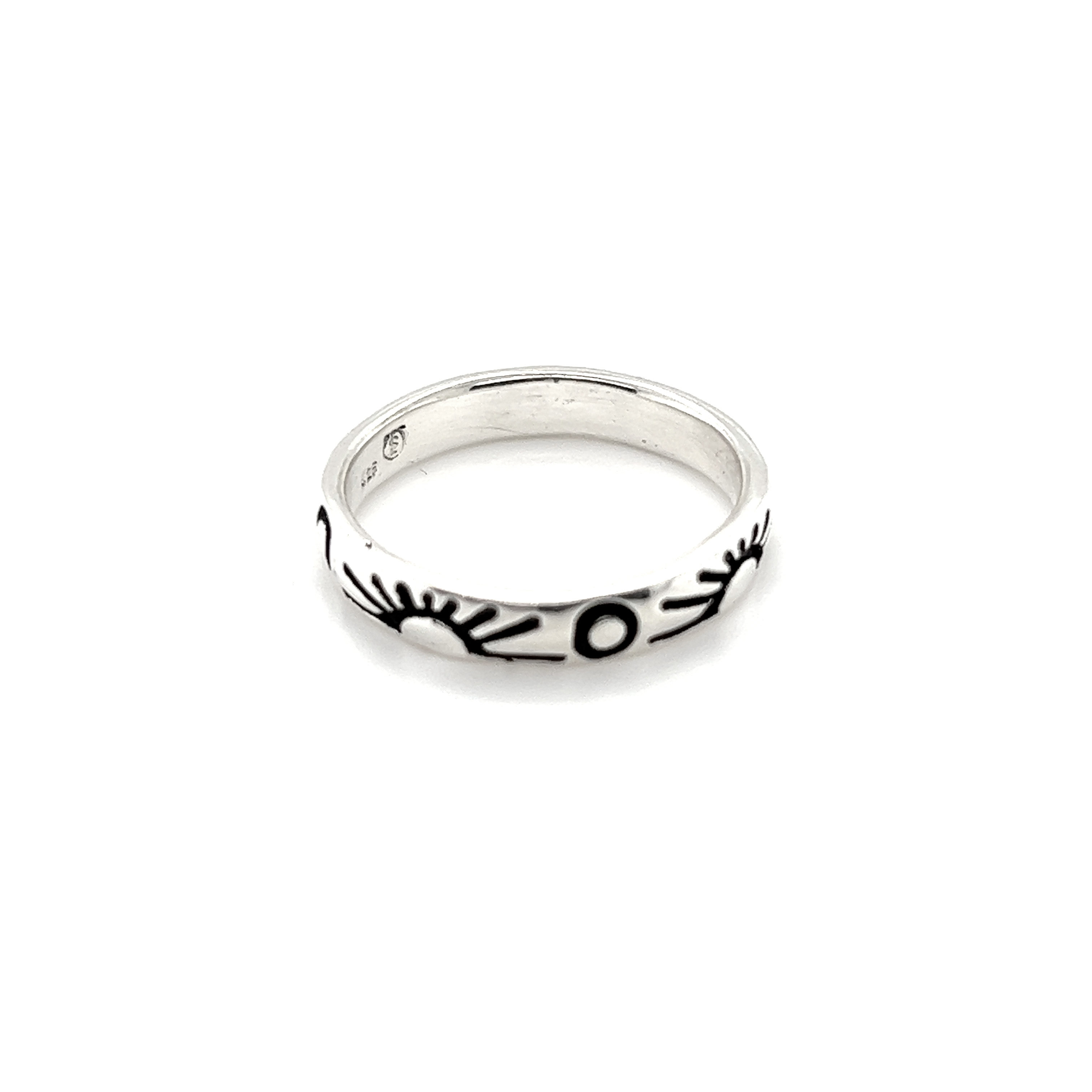 A Sun and Moon Etched Band Ring with black and white designs depicting a perfect balance of the sun and moon.