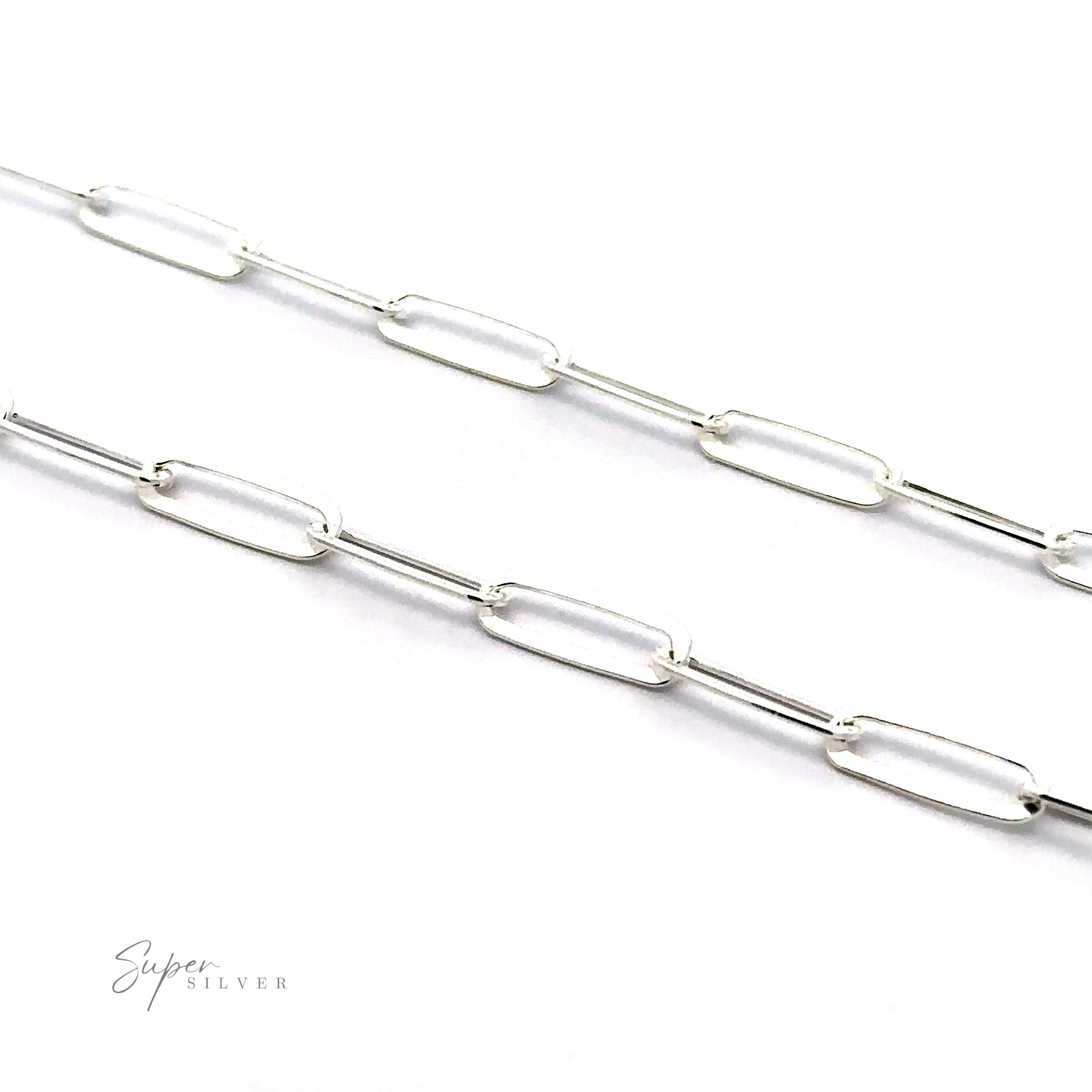 A close-up view of a Sterling Silver Paperclip Chain with elongated oval links on a white background. The minimalist design highlights expert Italian craftsmanship, while the Super Silver logo is visible in the bottom left corner.