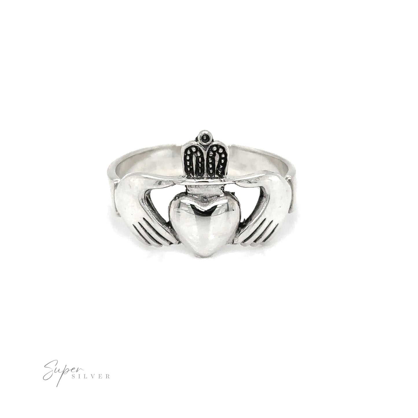 A silver thick claddagh ring symbolizing loyalty and love, with a heart on it.