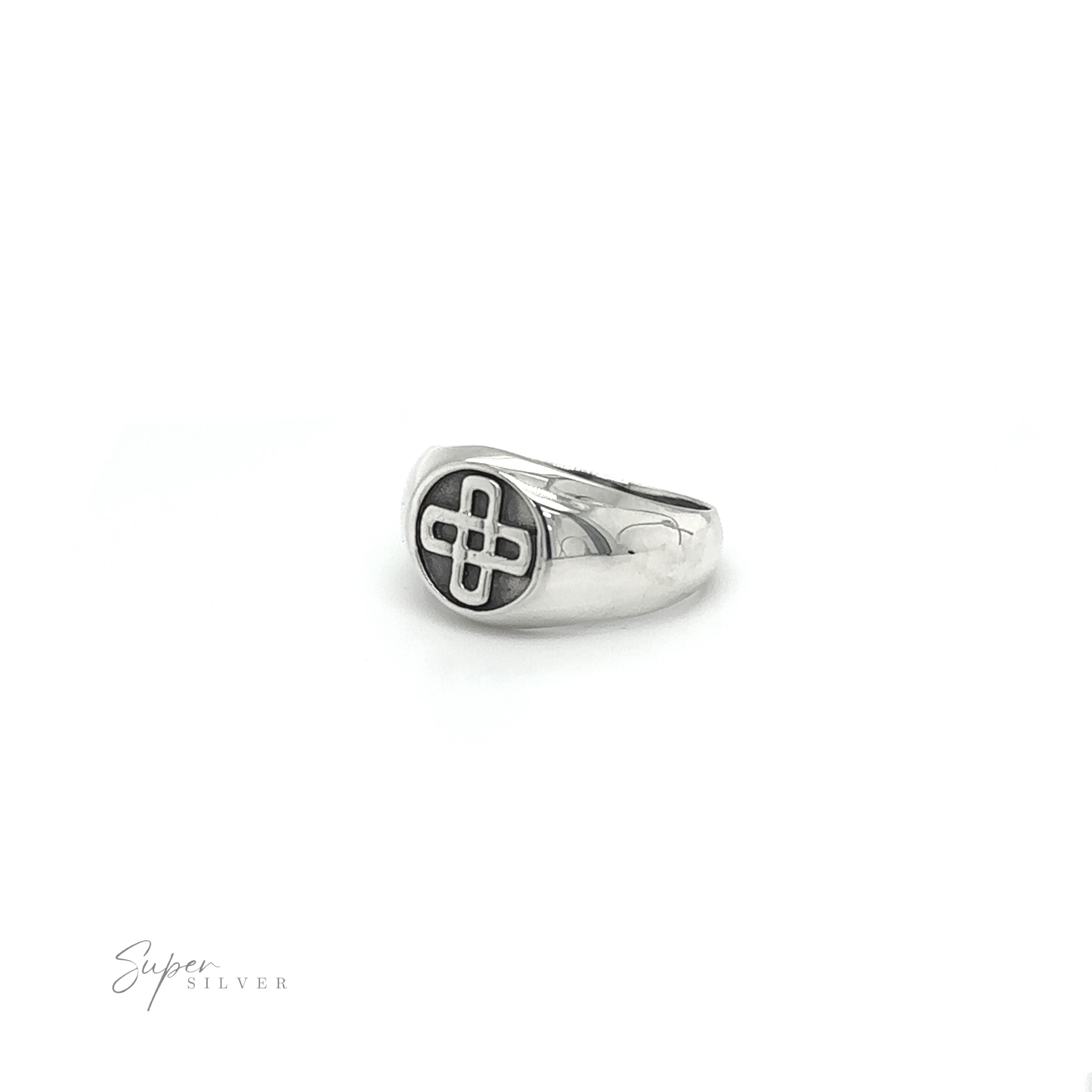 A bold and striking silver Celtic Solomon's Knot Signet Ring with an enigmatic cross engraving, reminiscent of the Solomon's Knot.