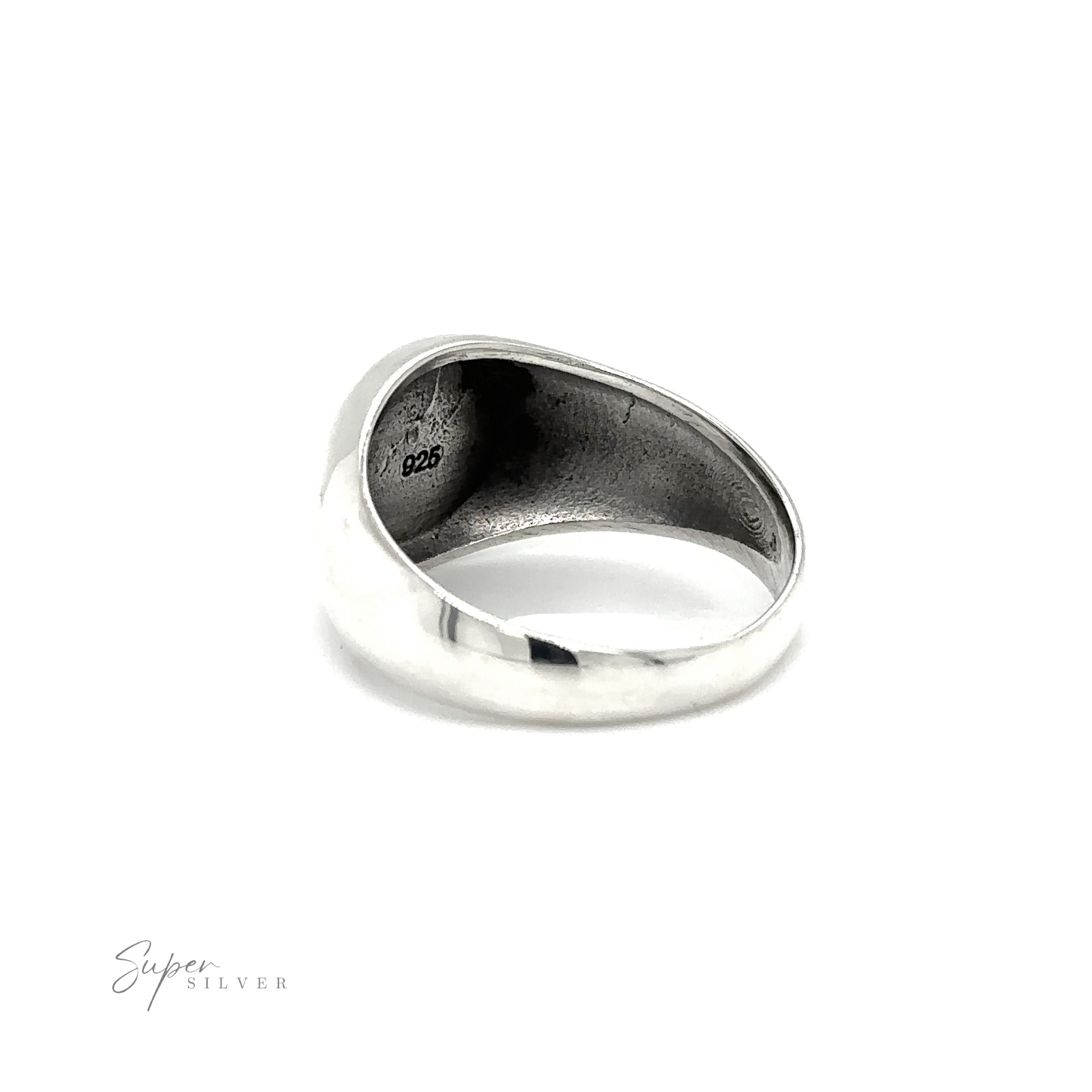 An enigmatic silver Celtic Solomon's Knot signet ring, on a white background.