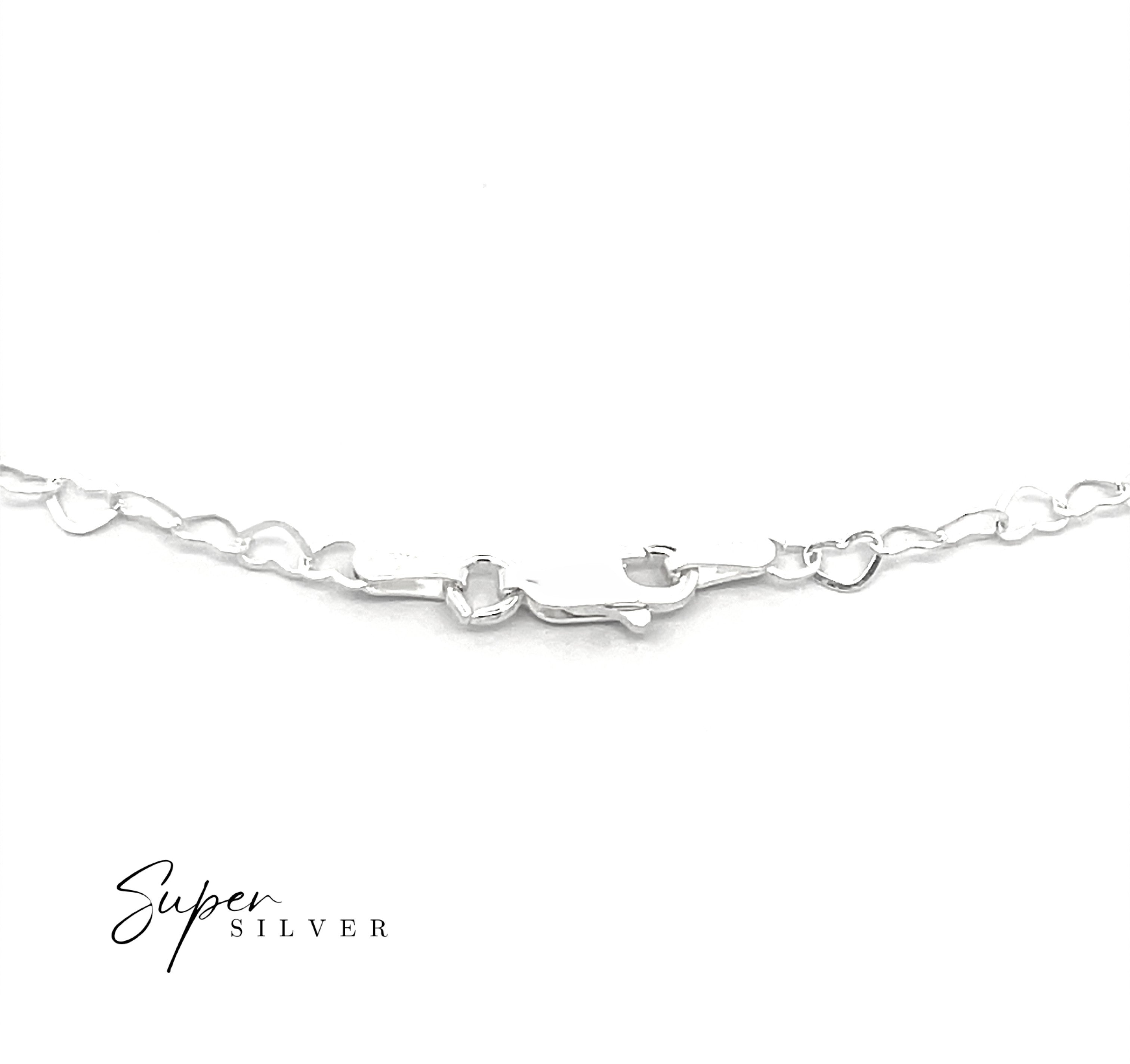The Italian Heart Link Chain, a delicate sterling silver bracelet with heart-shaped links, is displayed on a white background featuring the "Super Silver" logo in the corner.