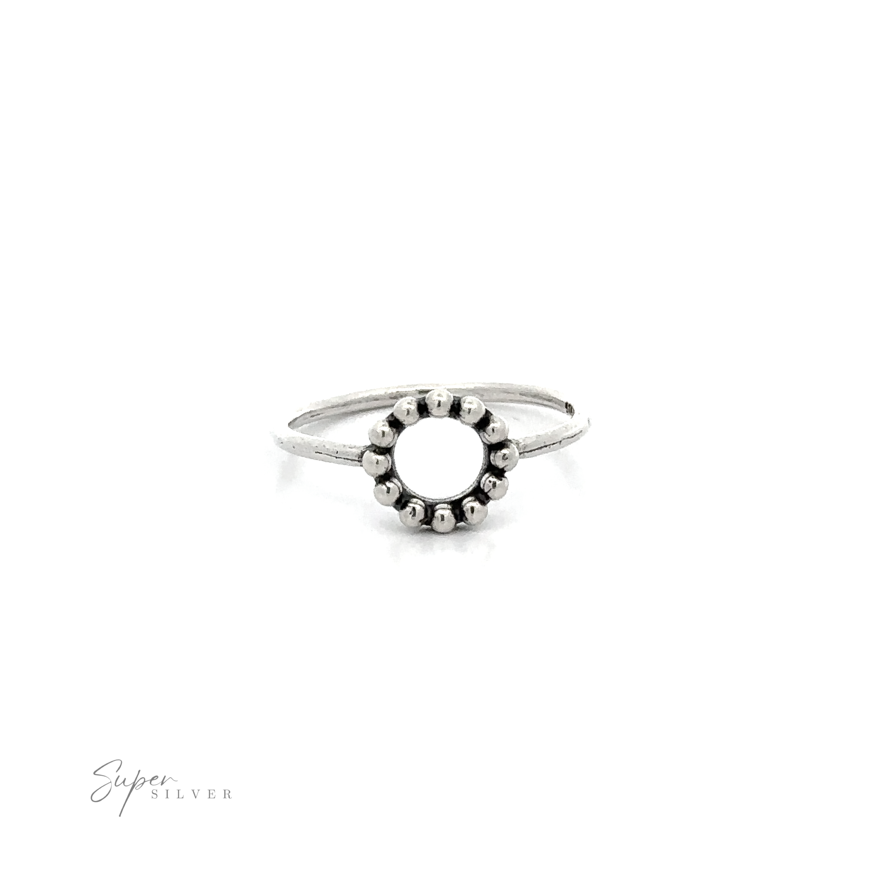 A Silver Ring With Circle And Beads with an oxidized finish and a beaded circle design in the middle.